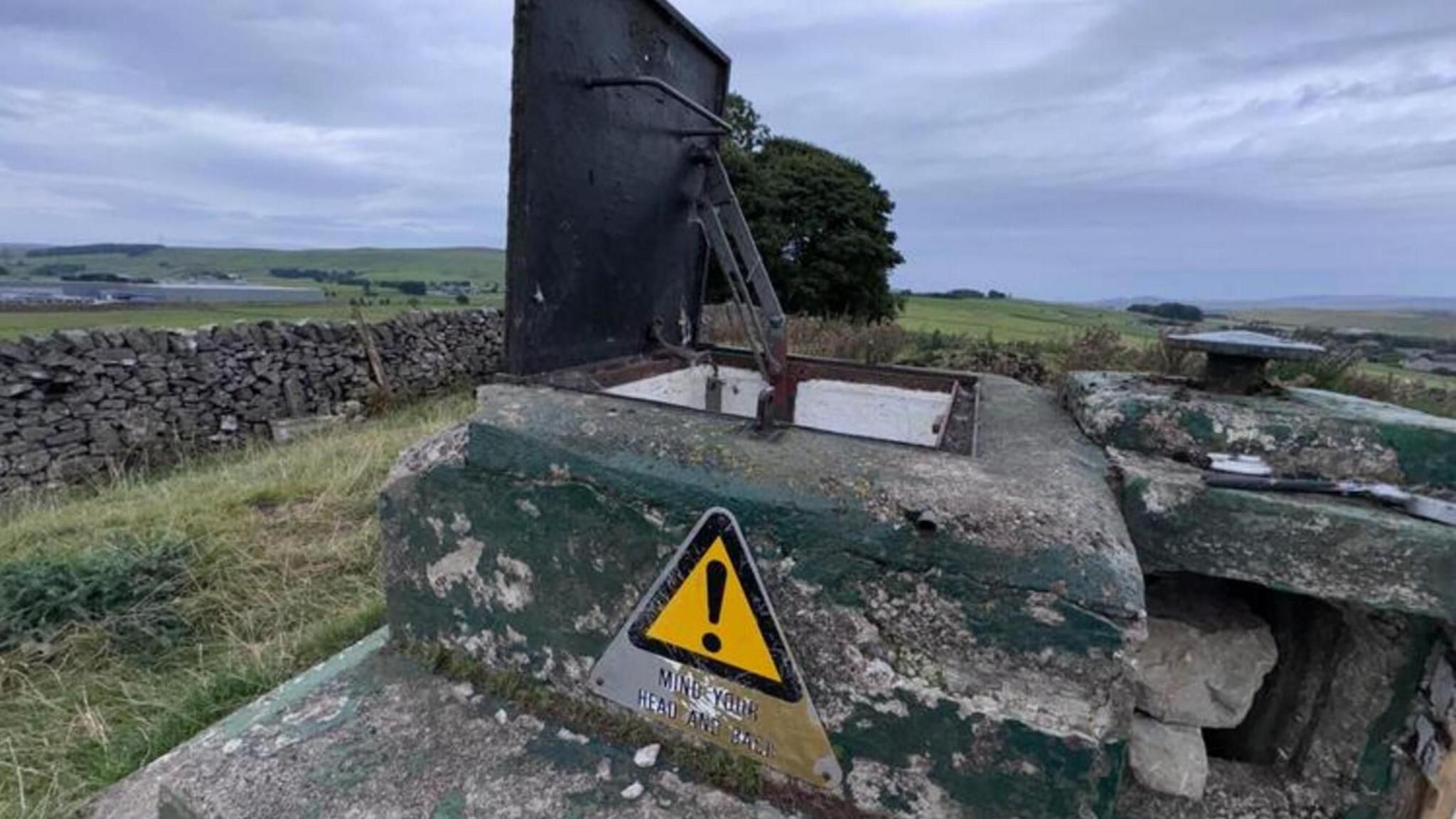 The concrete entrance to the bunker in a field near Buxton