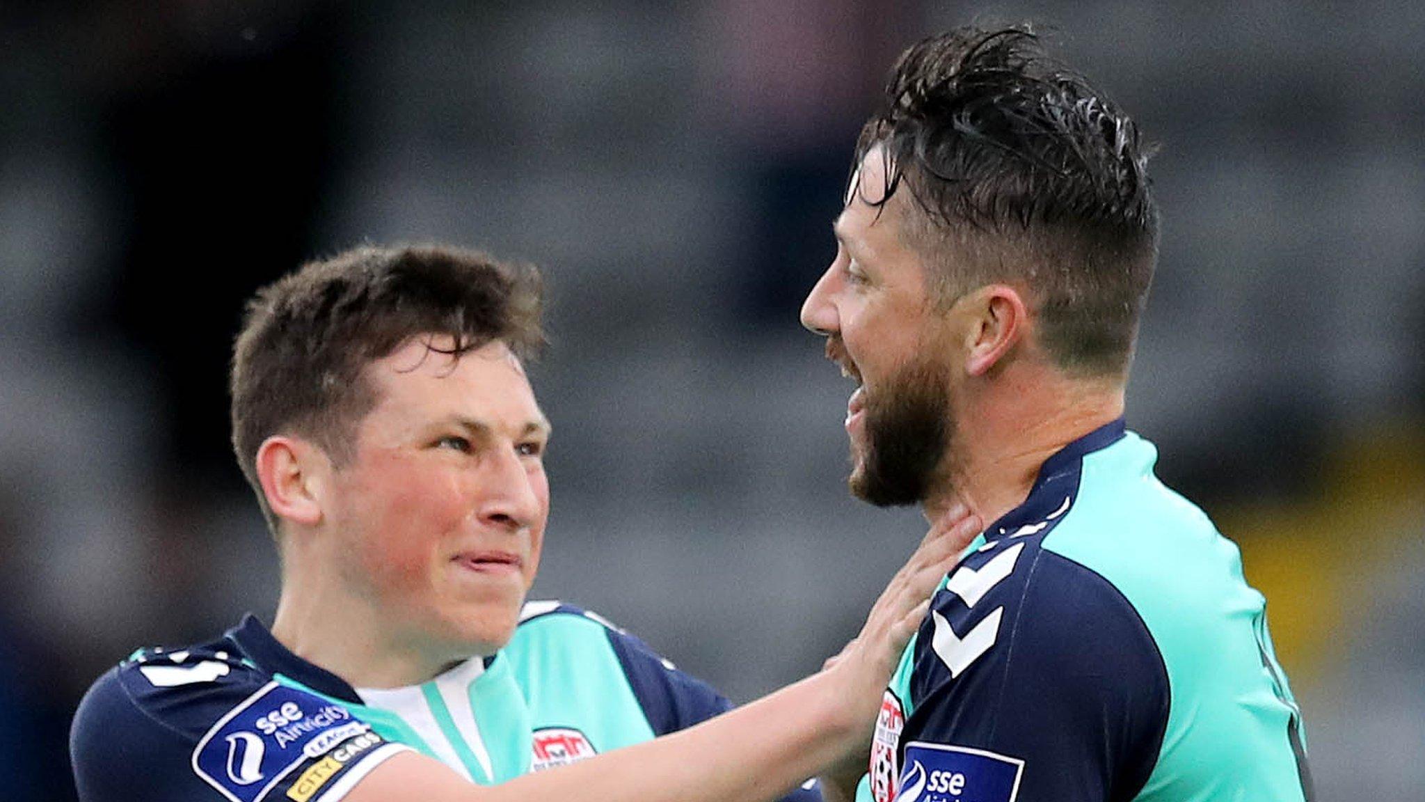 Rory Patterson (right) is congratulated by Conor McDermott after scoring Derry's winner at Dalymount Park