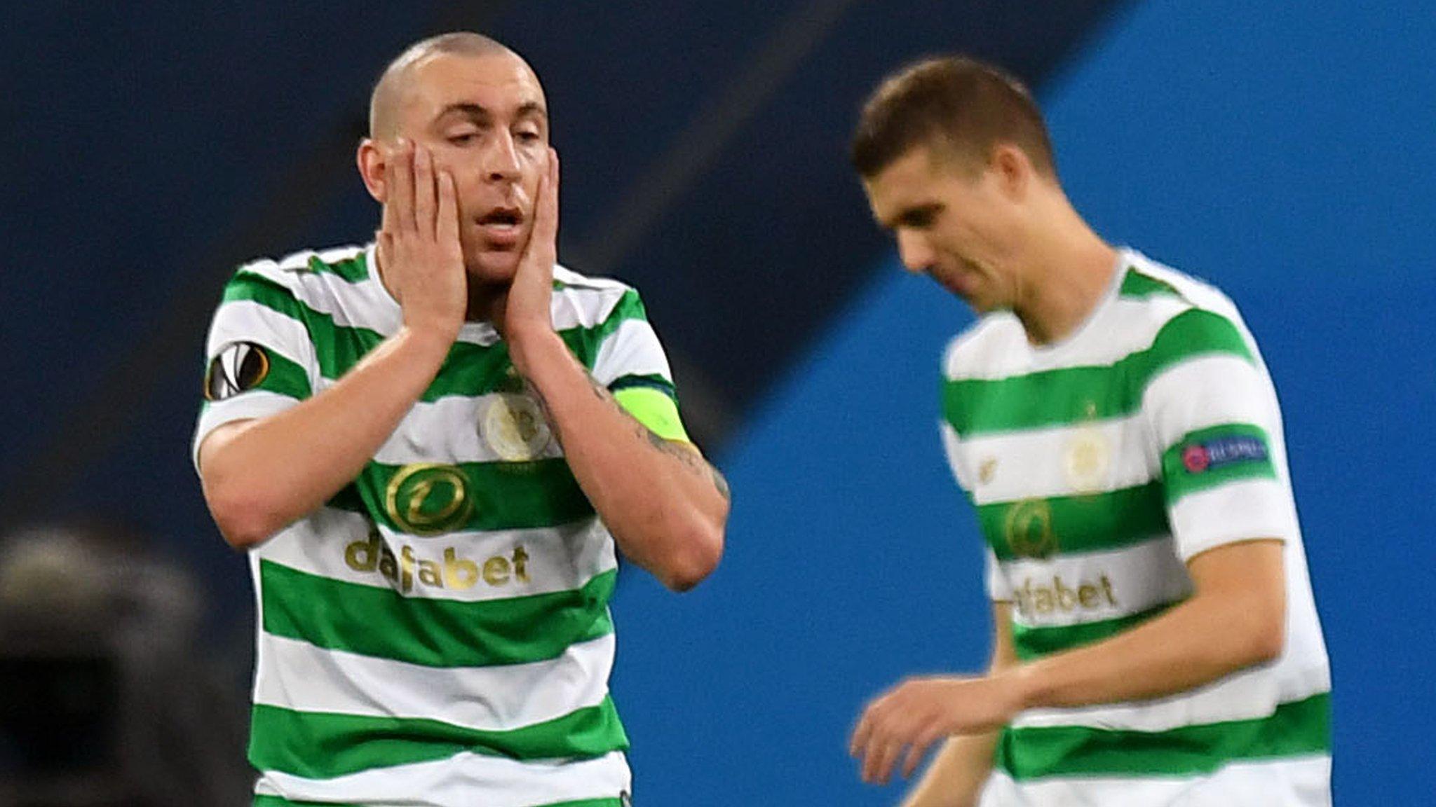 Celtic captain Scott Brown holds his head in his hands