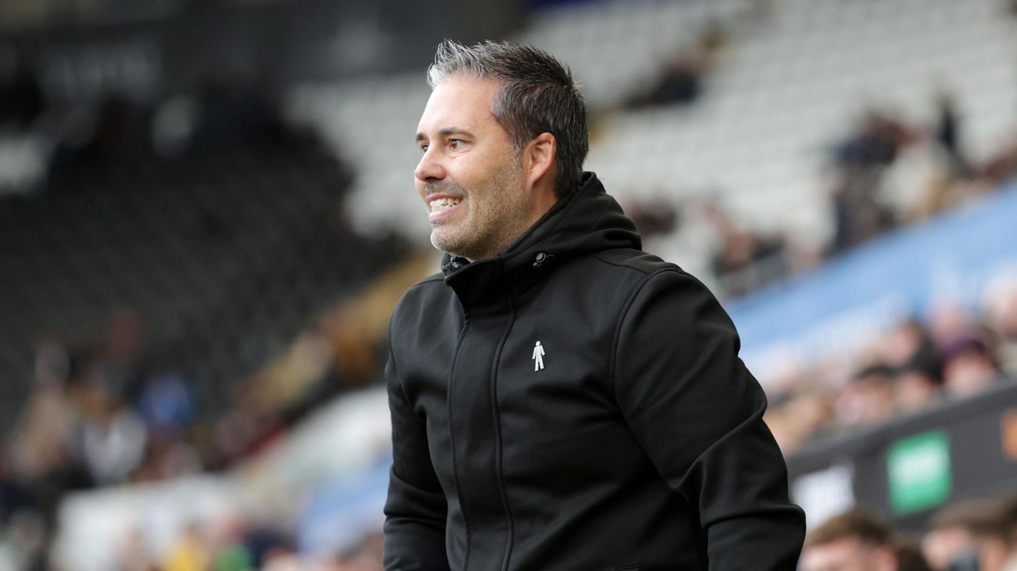 A photo of Leicester City boss Marti Cifuentes smiling
