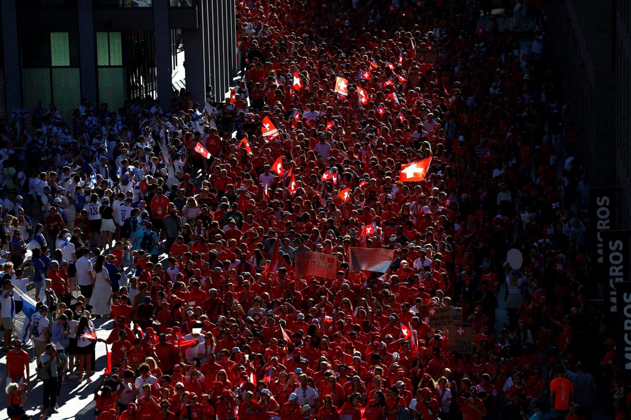 A crowd of Switzerland fans fill the streets of Geneva