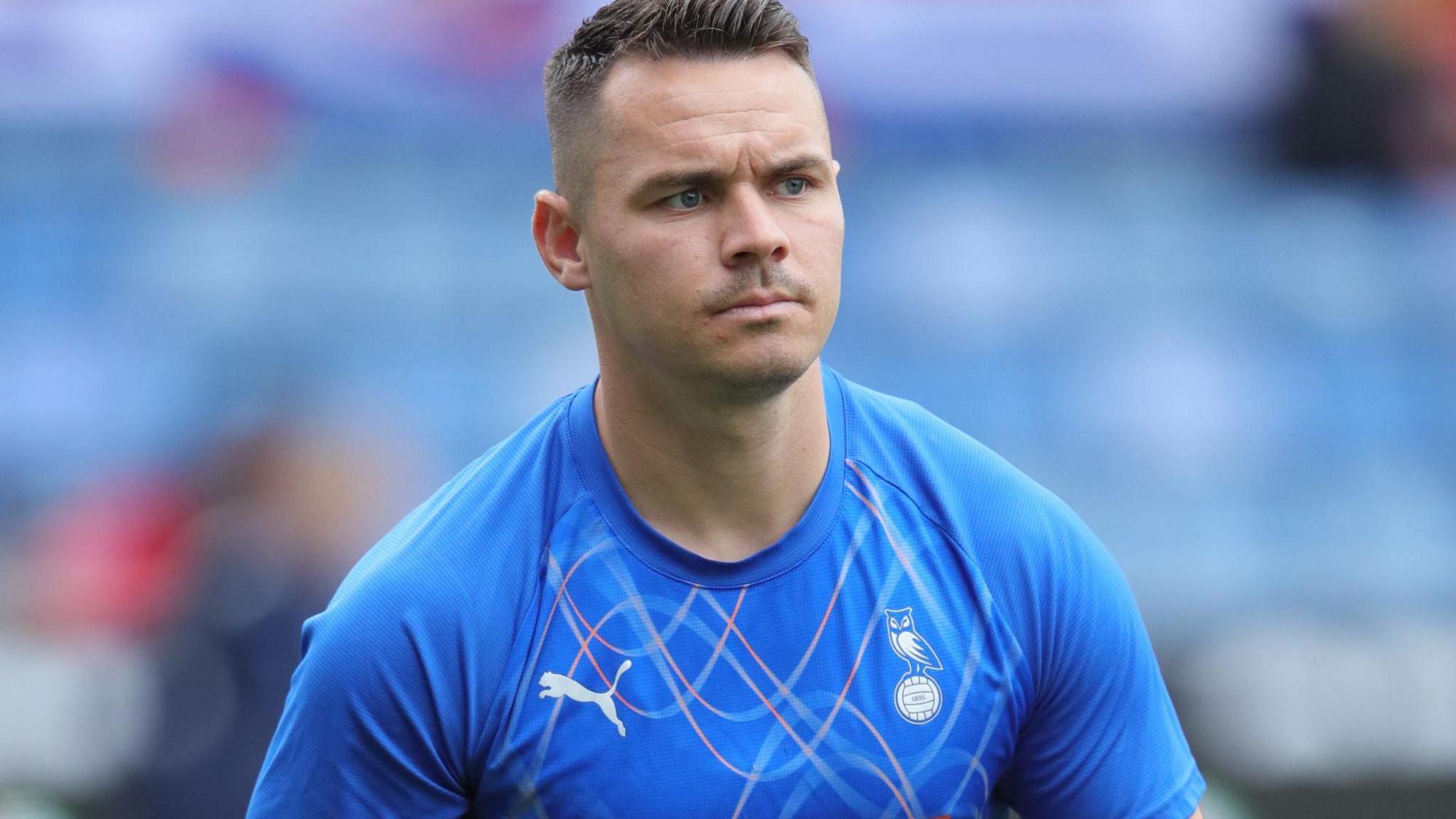 Billy Waters warming up before a match for Oldham Athletic
