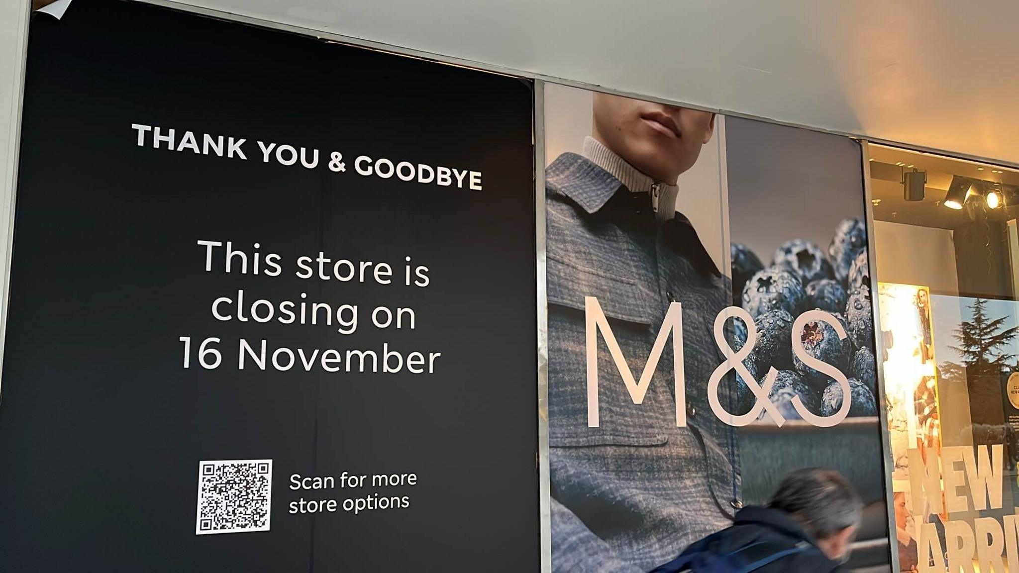 A sign on the front of the store which reads thank you and goodbye. This store is closing on 16 November