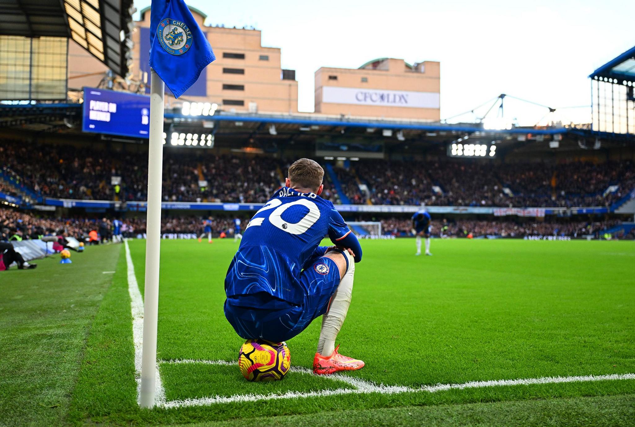 Cole Palmer of Chelsea sits on the ball during the Premier League match between Chelsea and Aston Villa at Stamford Bridge.