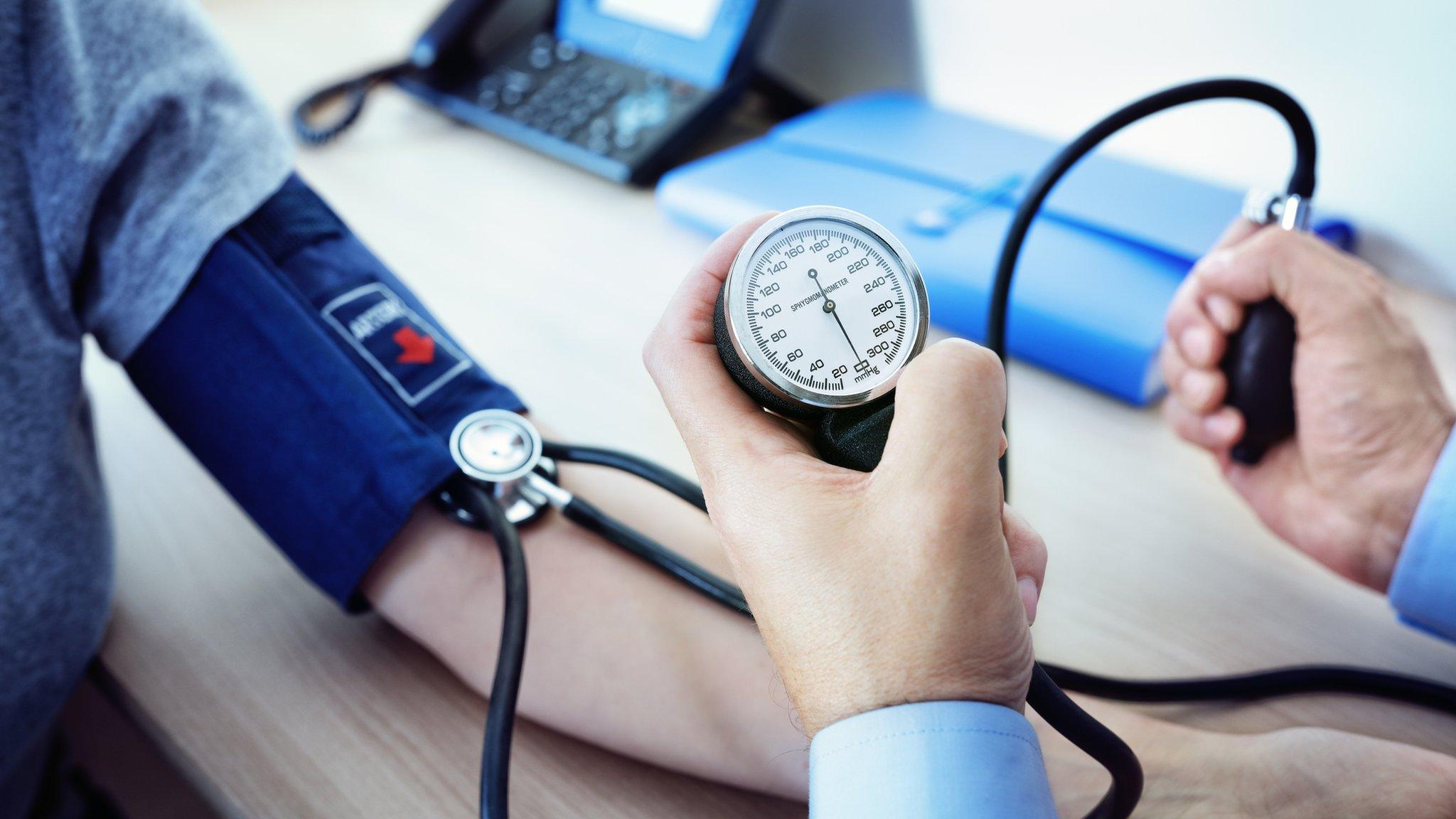 doctor taking blood pressure