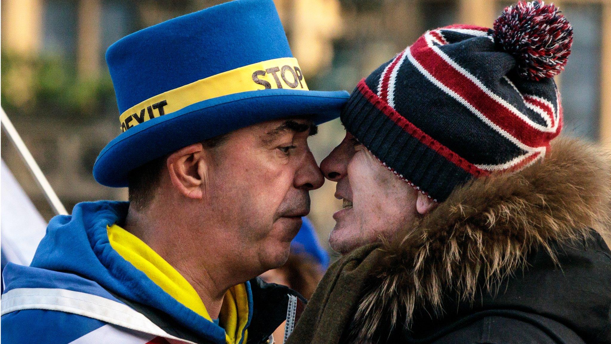 An Anti-Brexit protester (L) and a pro-Brexit protester argue in London