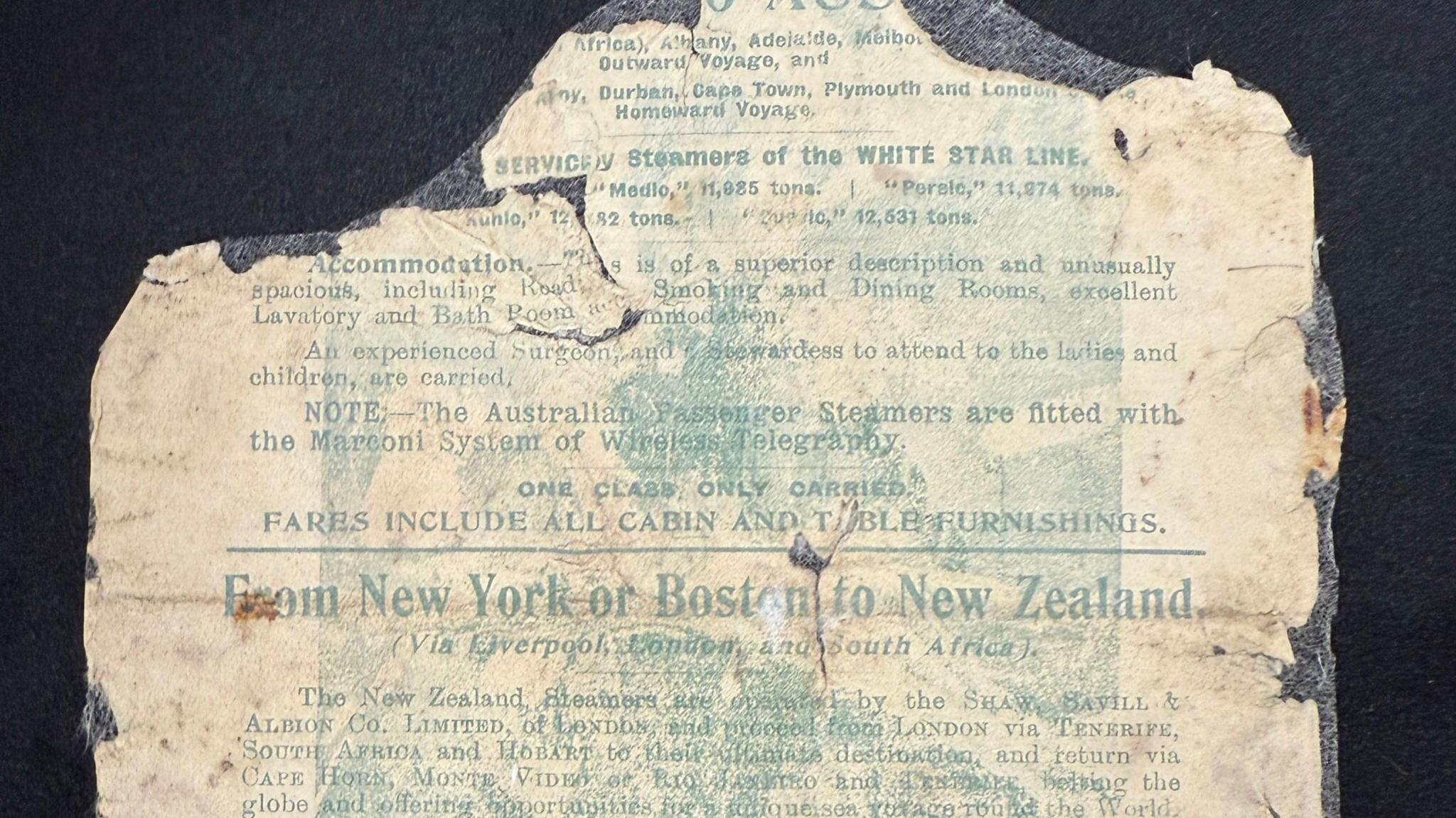 A very badly damaged piece of paper showing what appears to be an advertisement from the White Star Line with green text.