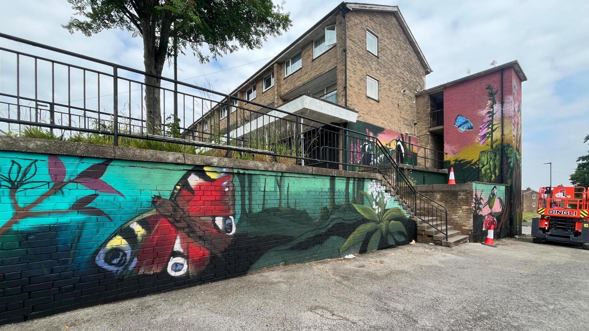 A mural showing a red butterfly