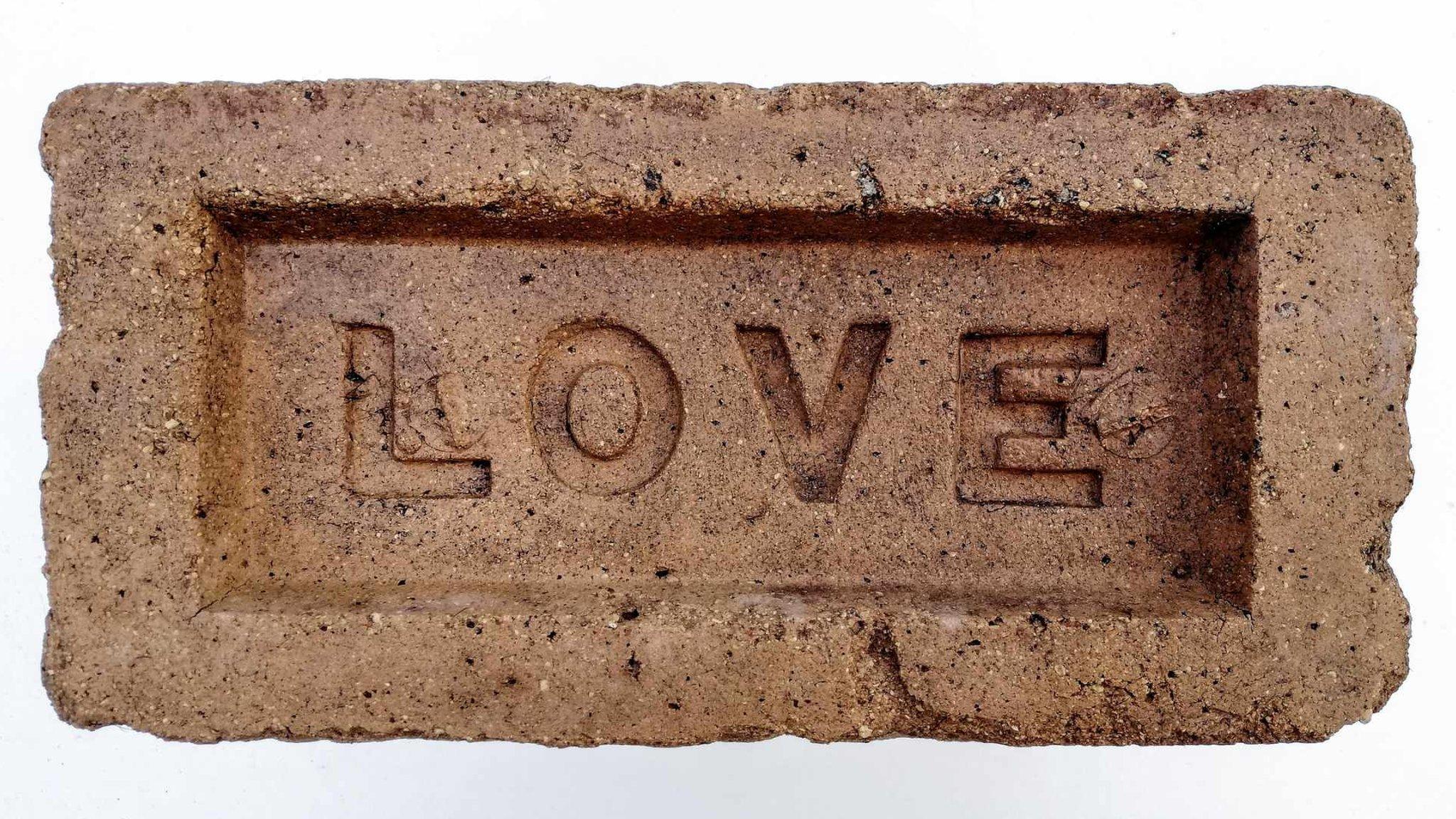 Brick with LOVE stamped on it