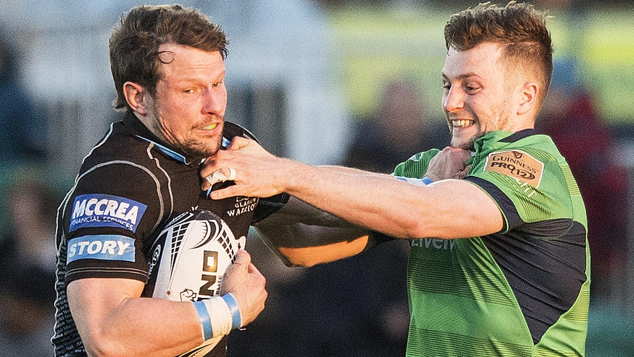 Glasgow captain Peter Horne holds off Connacht's Jack Carty