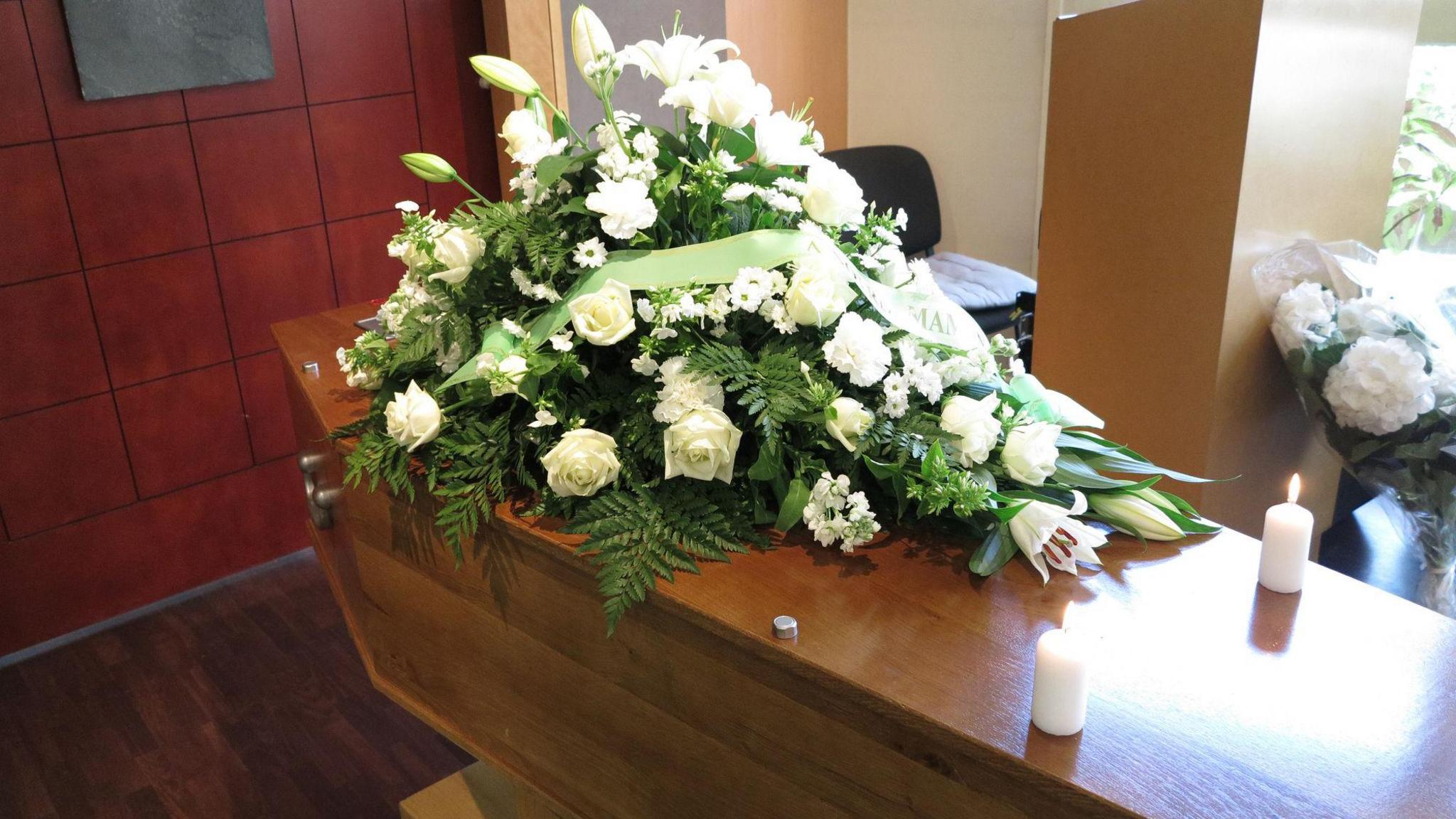 Coffin with flowers on top