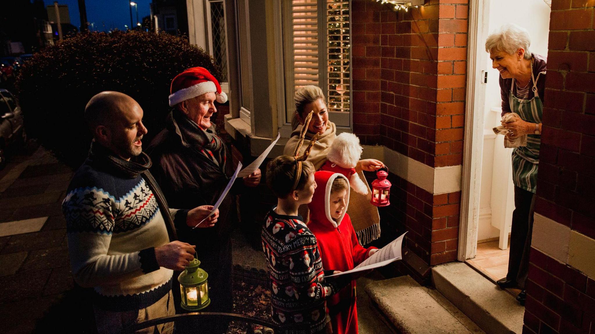 Family are doing door-to-door carol singing