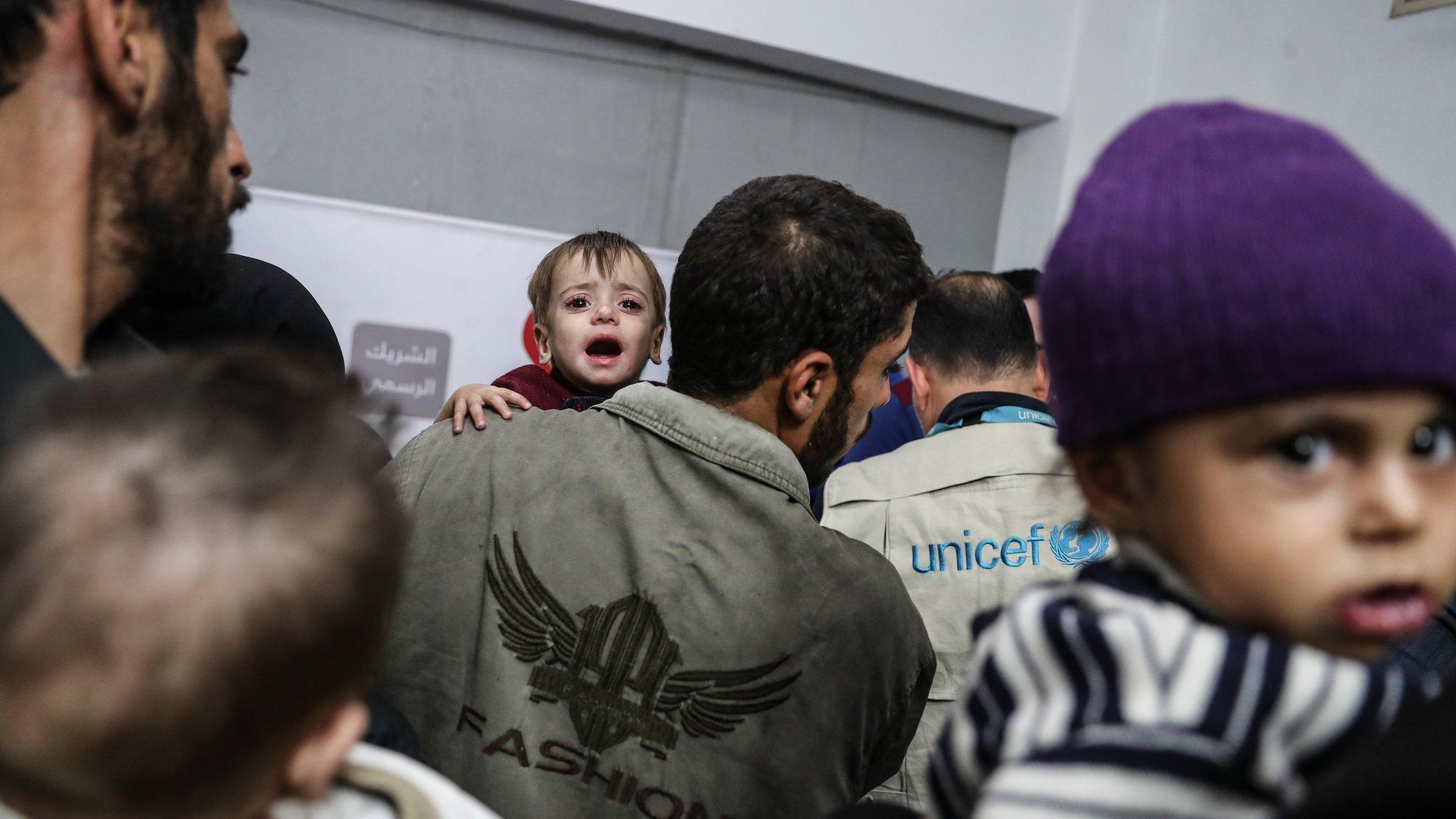 Children suffering from malnutrition wait to be seen by UN doctors in Douma, in the Eastern Ghouta, Syria (12 November 2017)