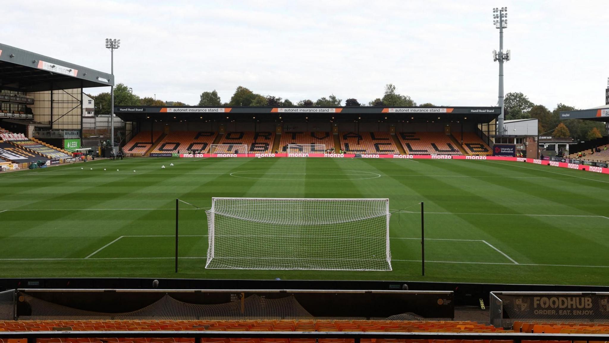 An empty Vale Park football stadium pictured from behind one of the goals.