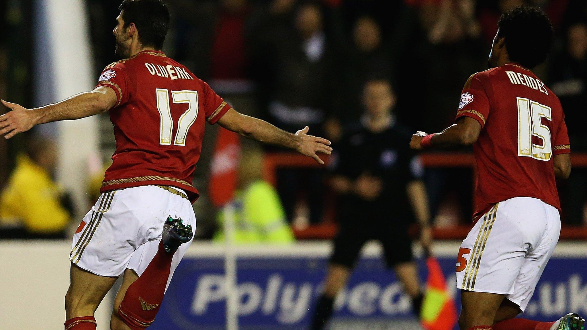 Nelson Oliveira (left) celebrates scoring for Forest