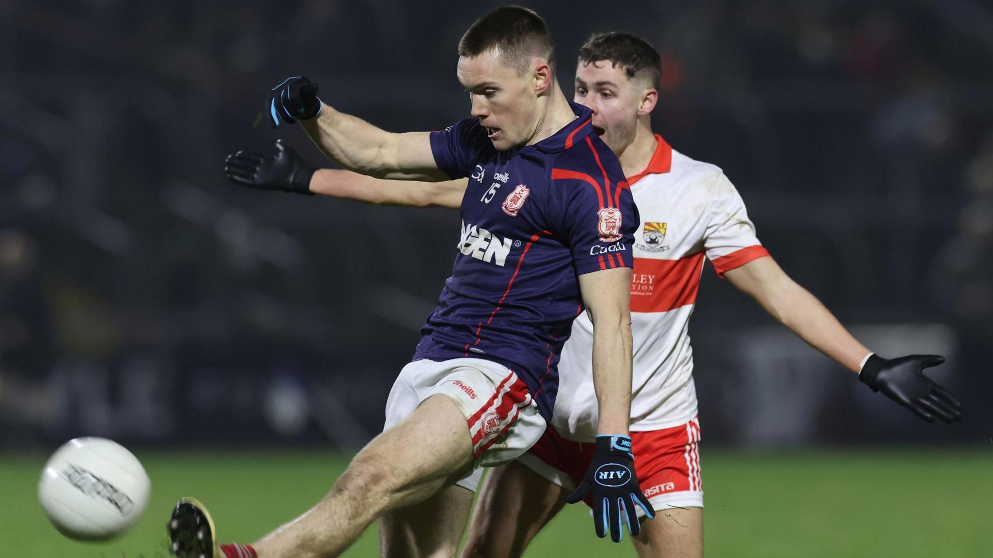 Cuala's Con O'Callaghan gets in a shot against Coolera/Strandhill despite the efforts of Danny Conroy