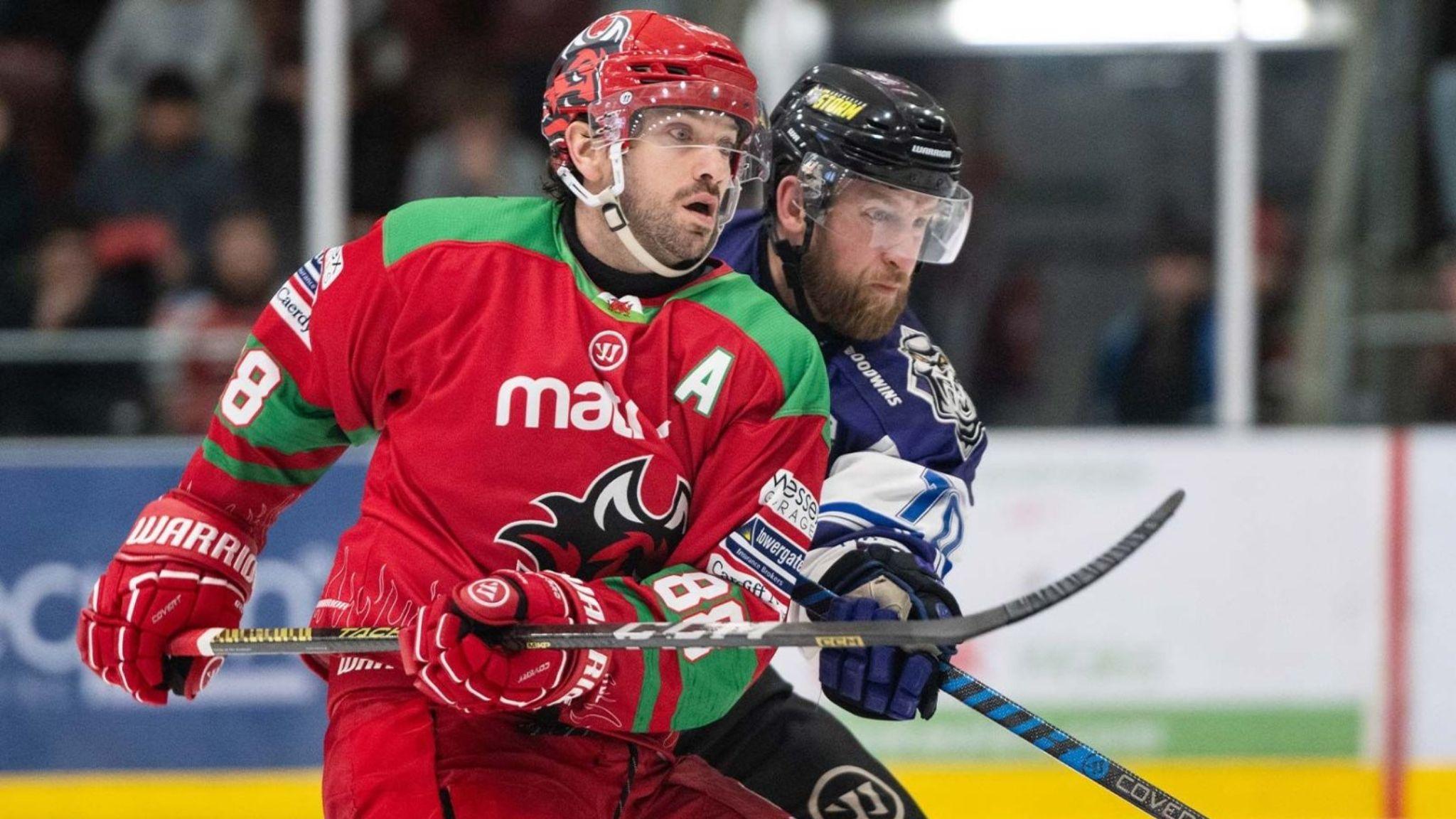 Cardiff Devils' Joey Martin tussles with a Manchester Storm player