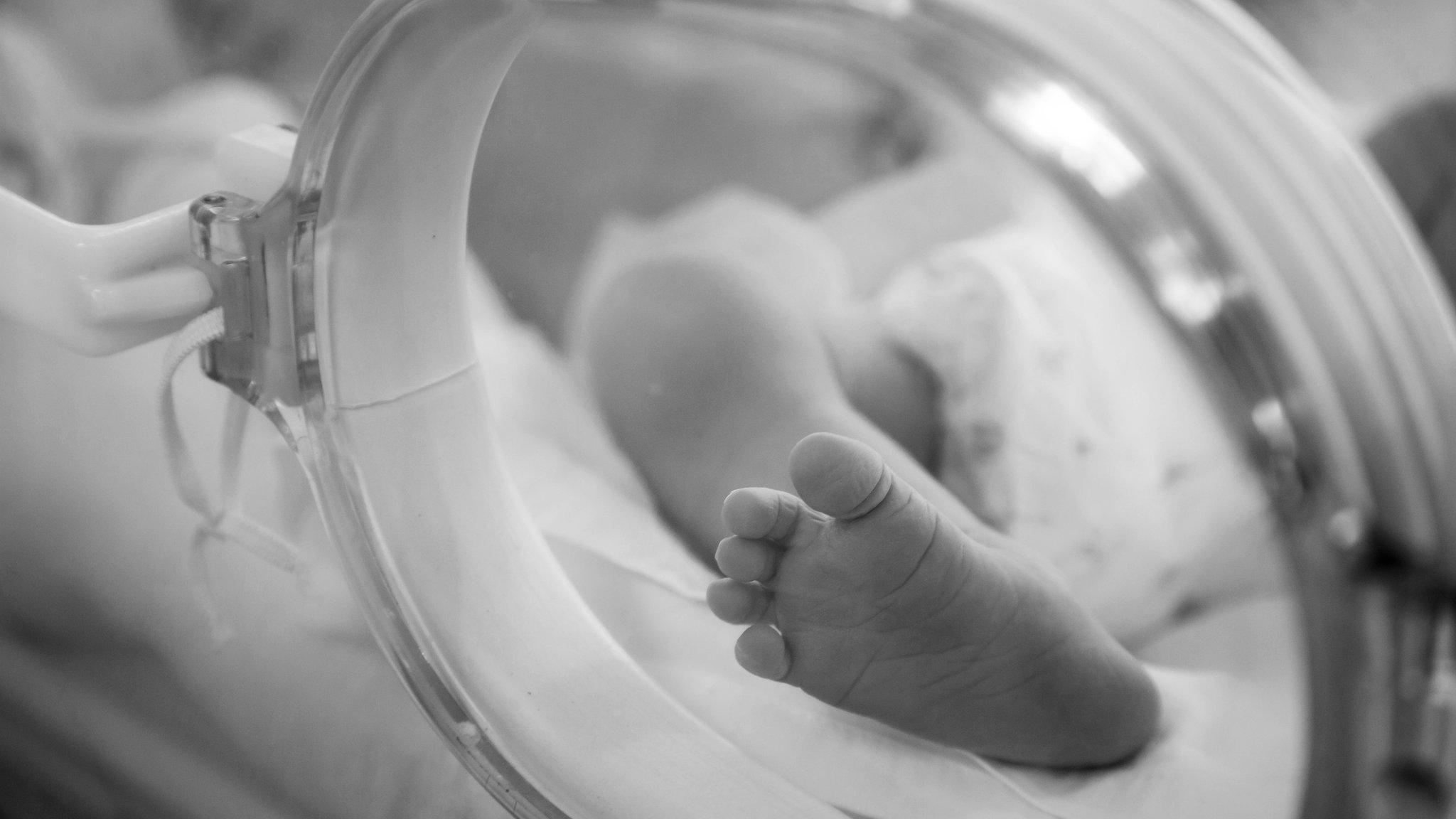 Neonatal special care -image shows baby's foot in incubator