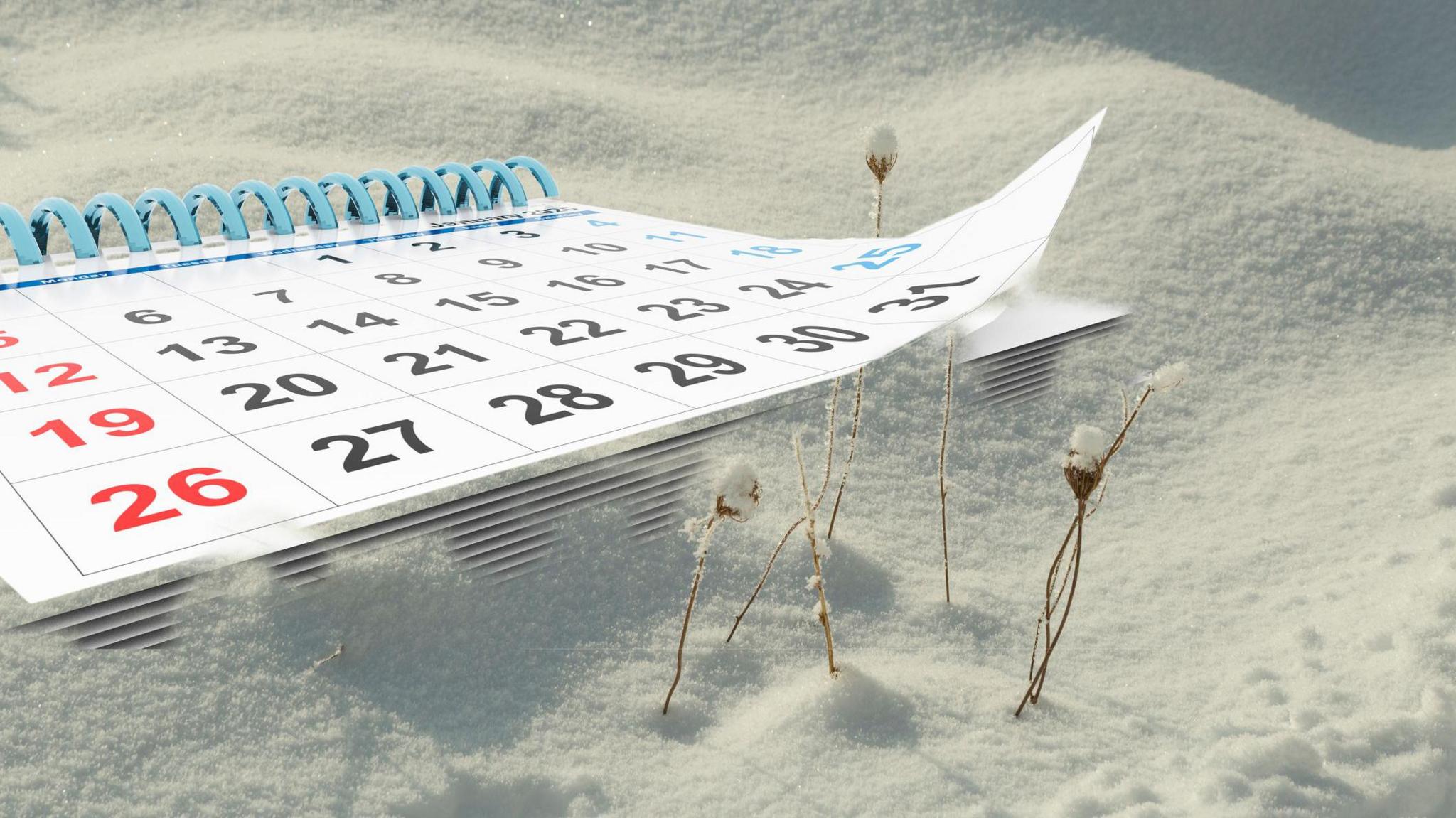 Digitally altered image of a calendar lying on snow