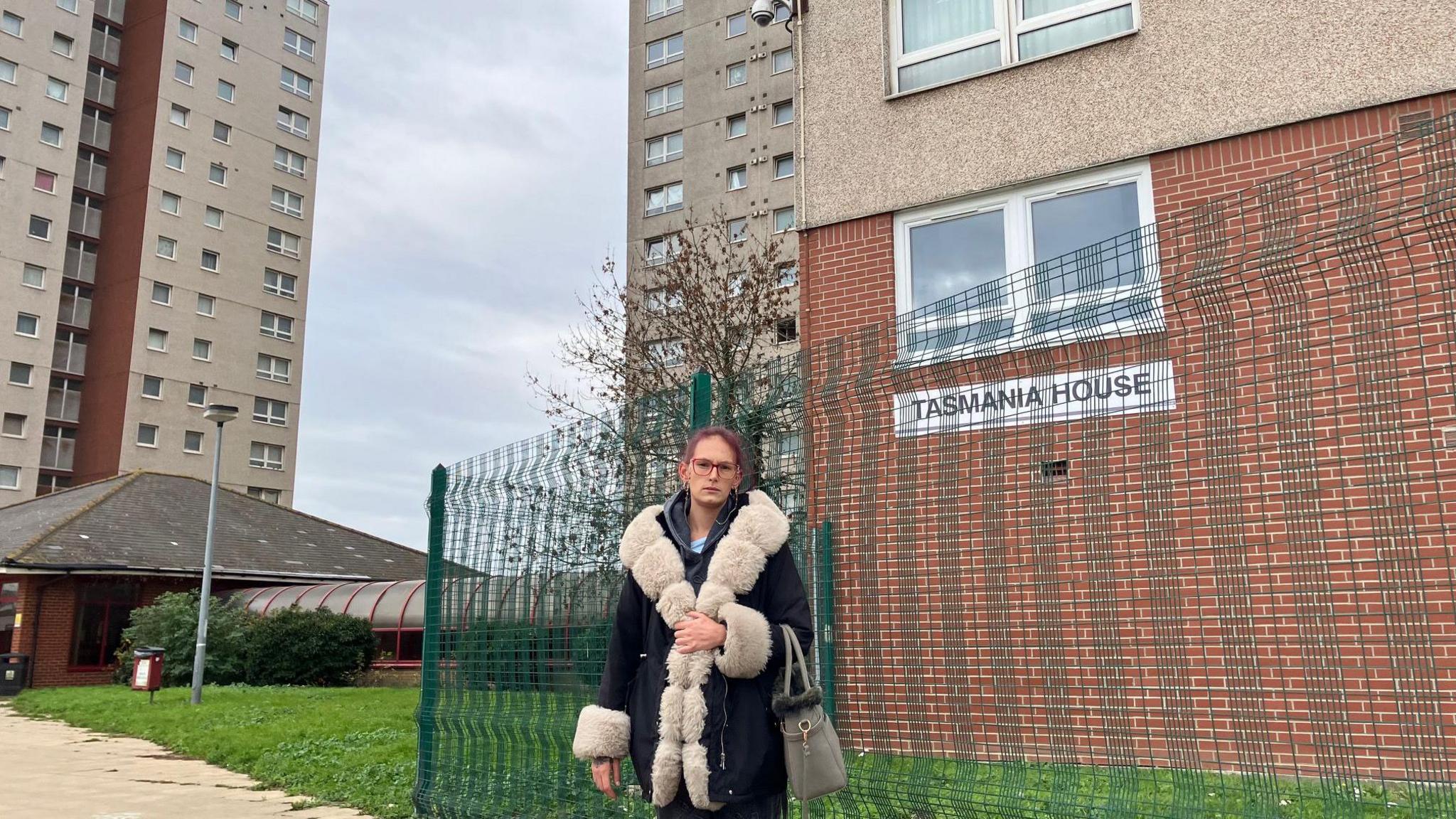 Stevie Barter standing outside Tasmania House, which is a high-rise block of flats in Tilbury.