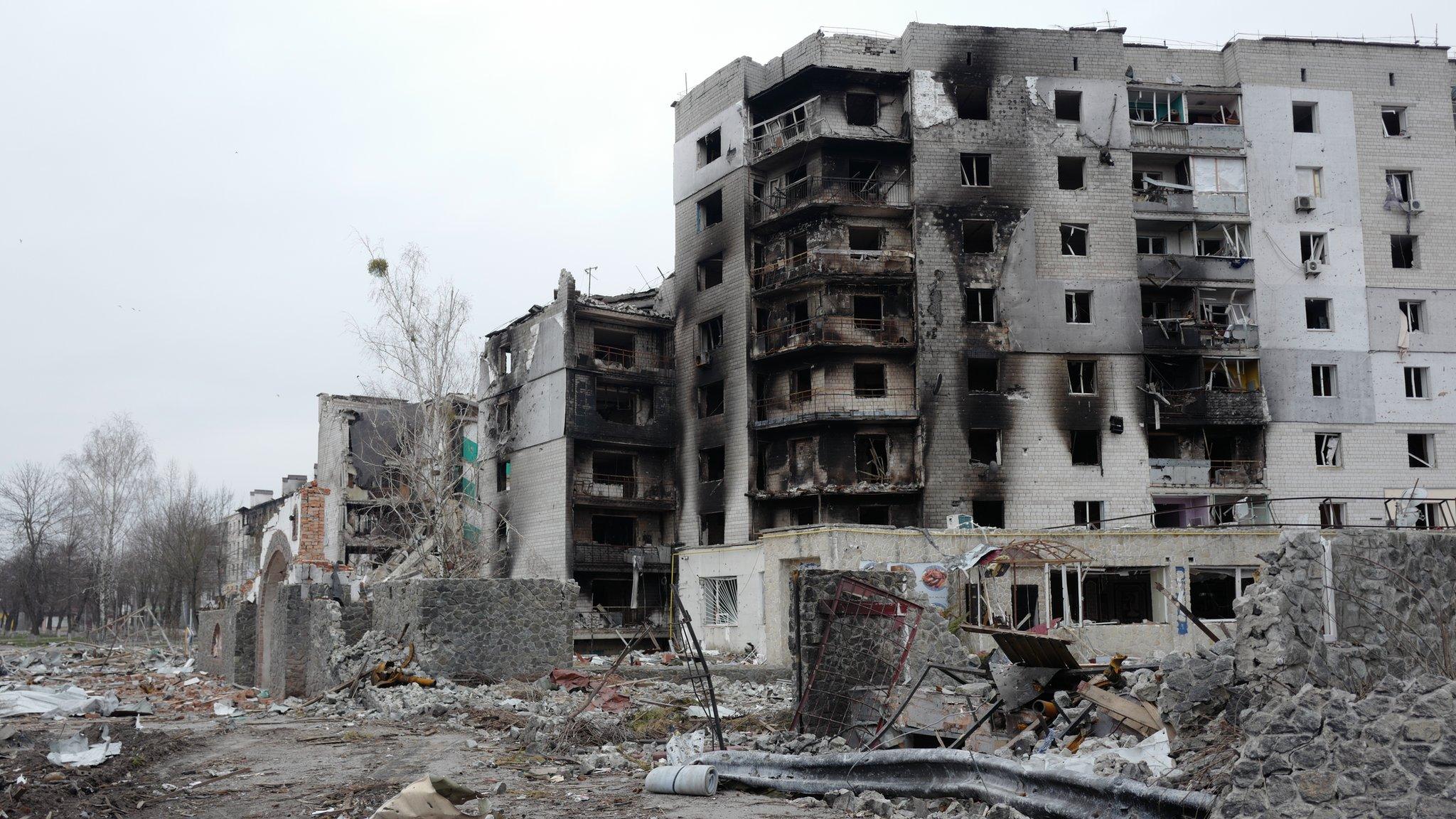 Image shows destroyed apartment building