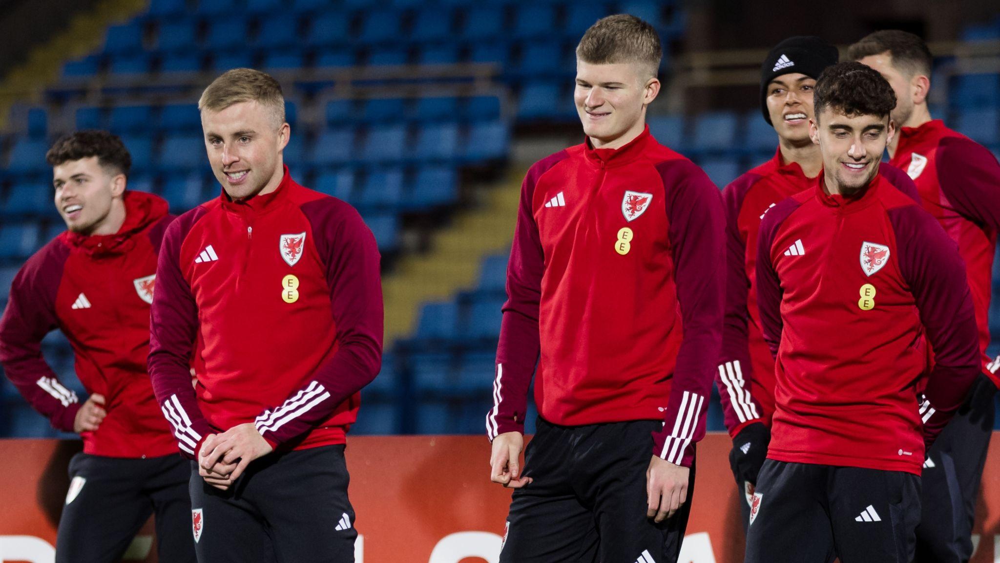 Joe Morrell (second left) and Wales colleagues smile during training