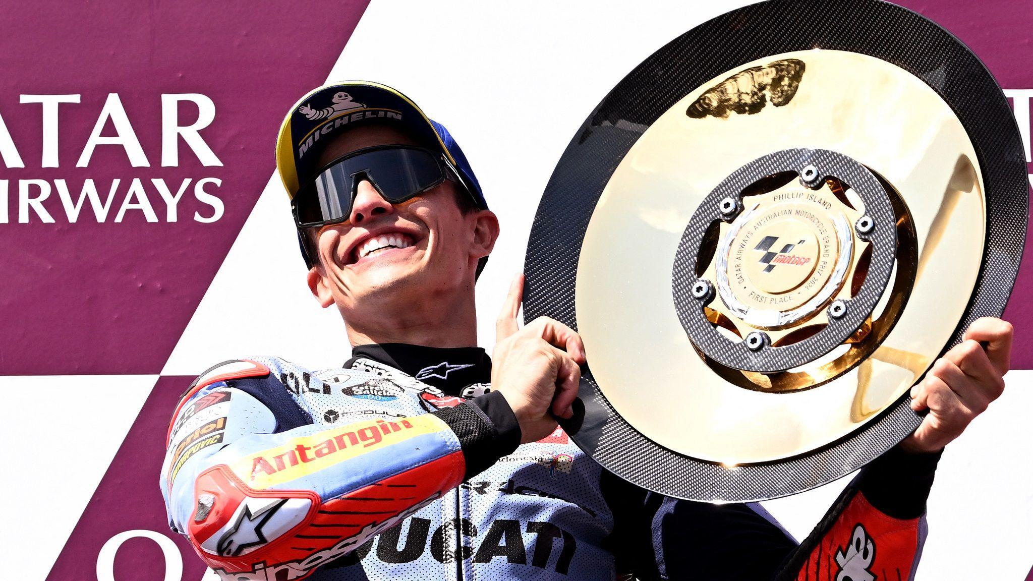 Marc Marquez lifts the trophy after winning the Australian Grand Prix