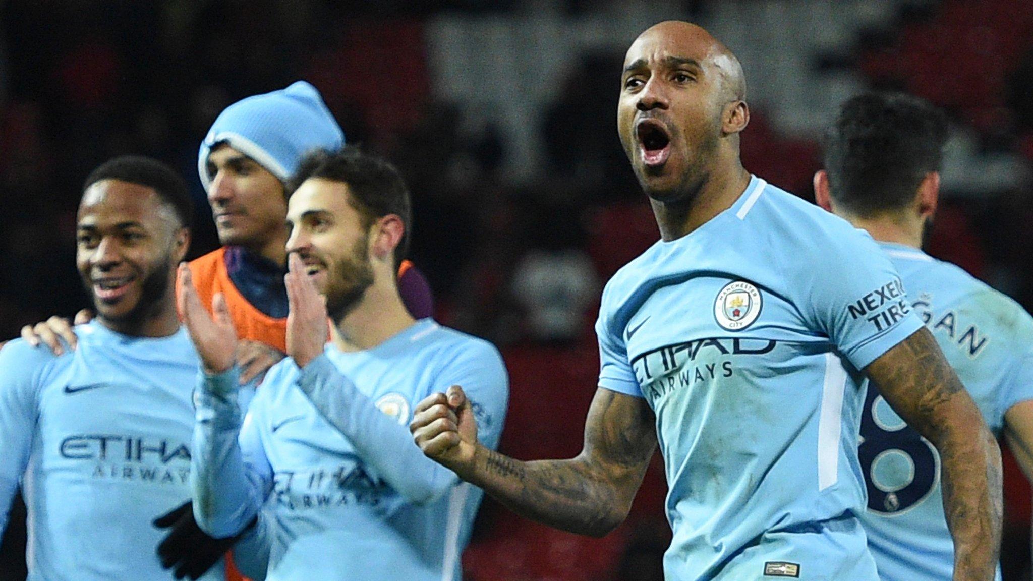 Fabian Delph and his team-mates celebrate beating Manchester United