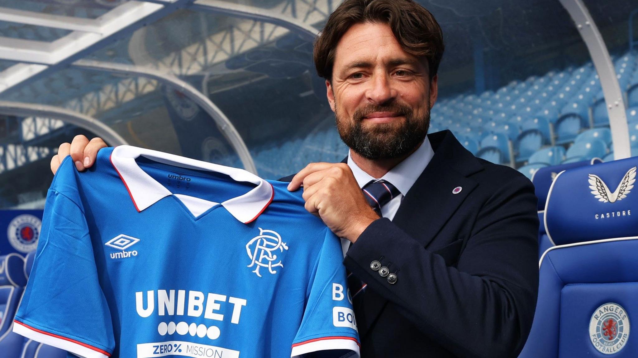 Russell Martin holding up a strip