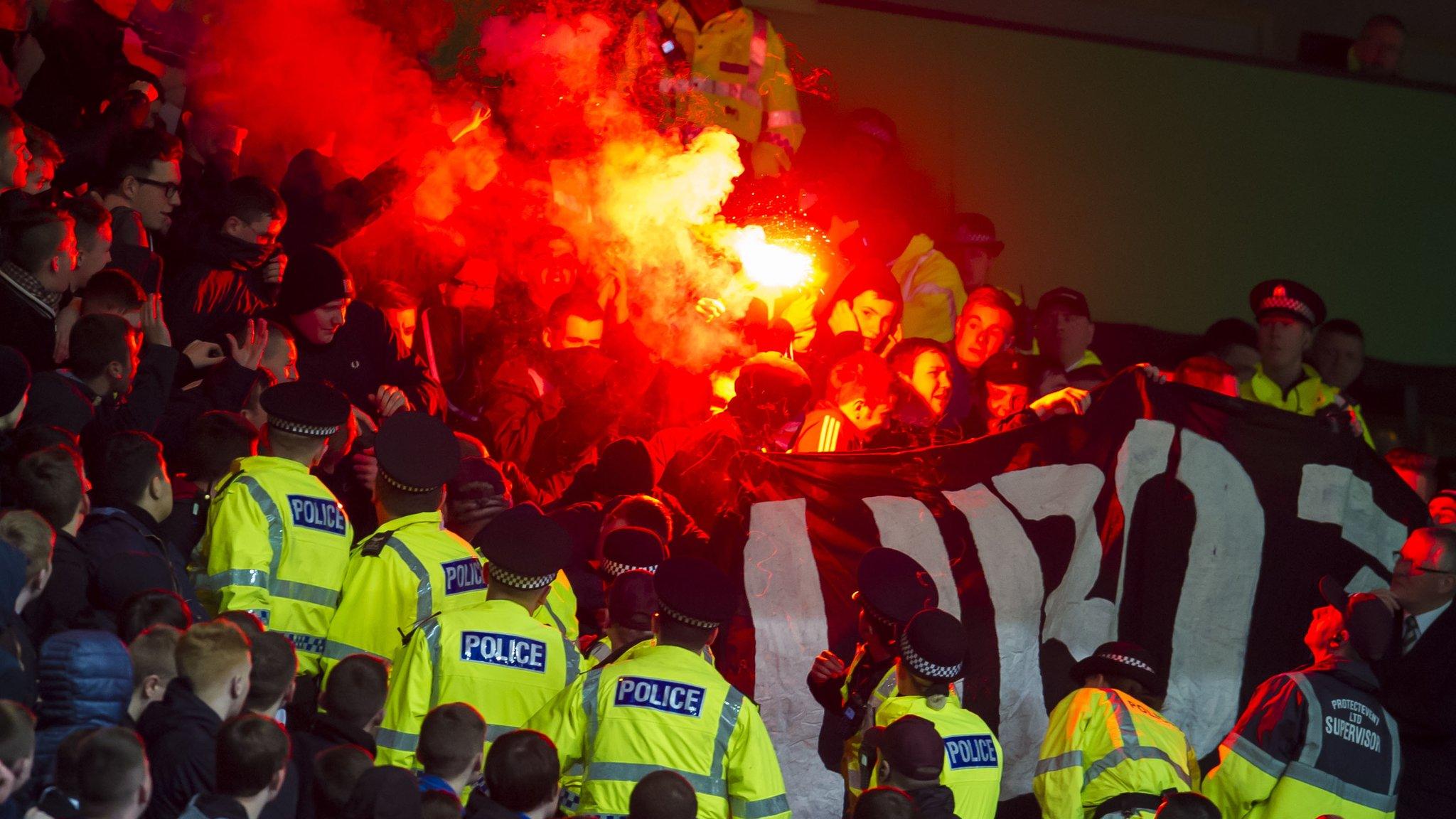 Police and stewards take action as flares at let off