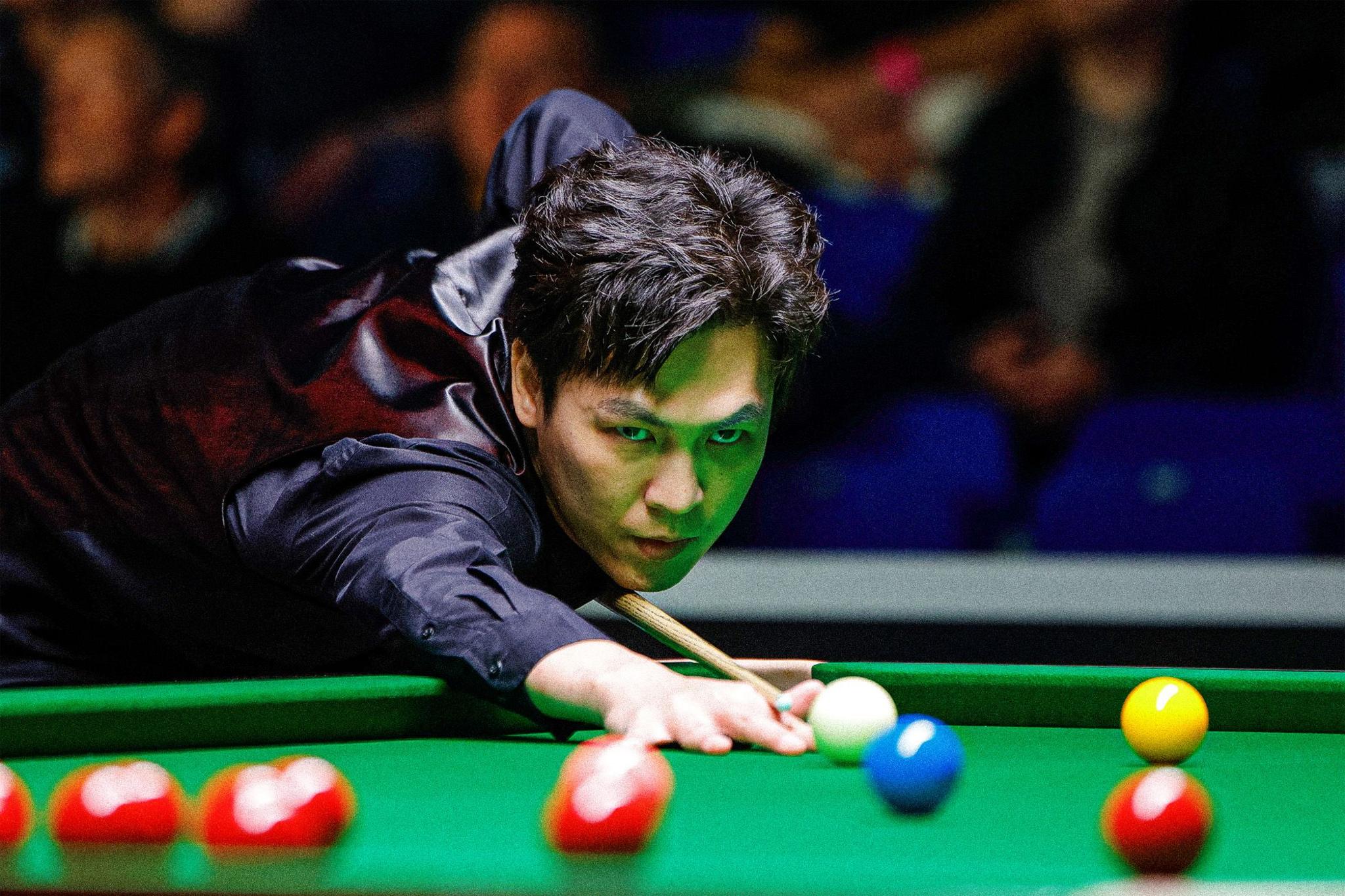 Thailand's Thepchaiya Un-Nooh plays a shot during the third-round match against Matthew Stevens of Wales at the World Championship qualifiers in Sheffield, England