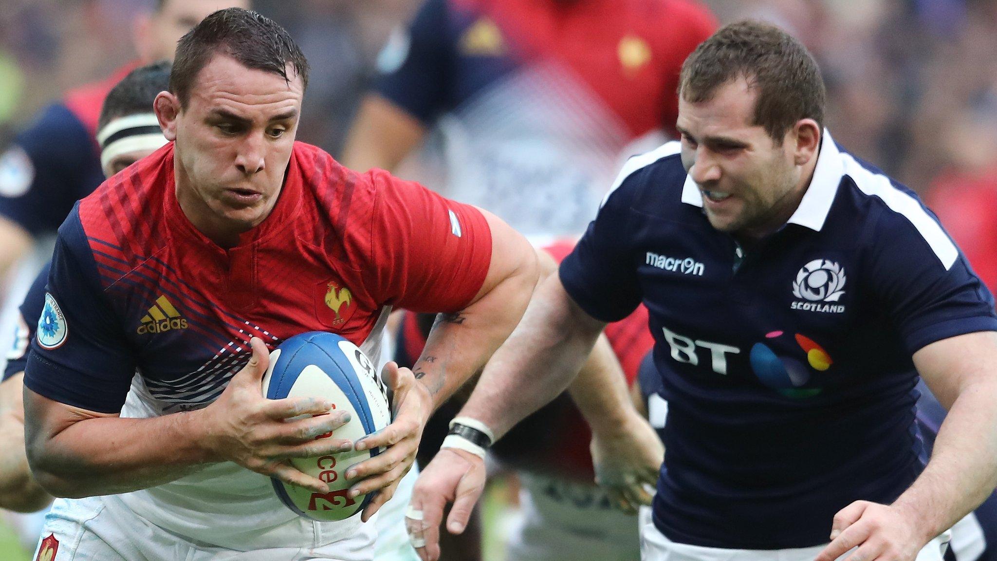 France number eight Louis Picamoles runs with the ball as Scotland hooker Fraser Brown looks on