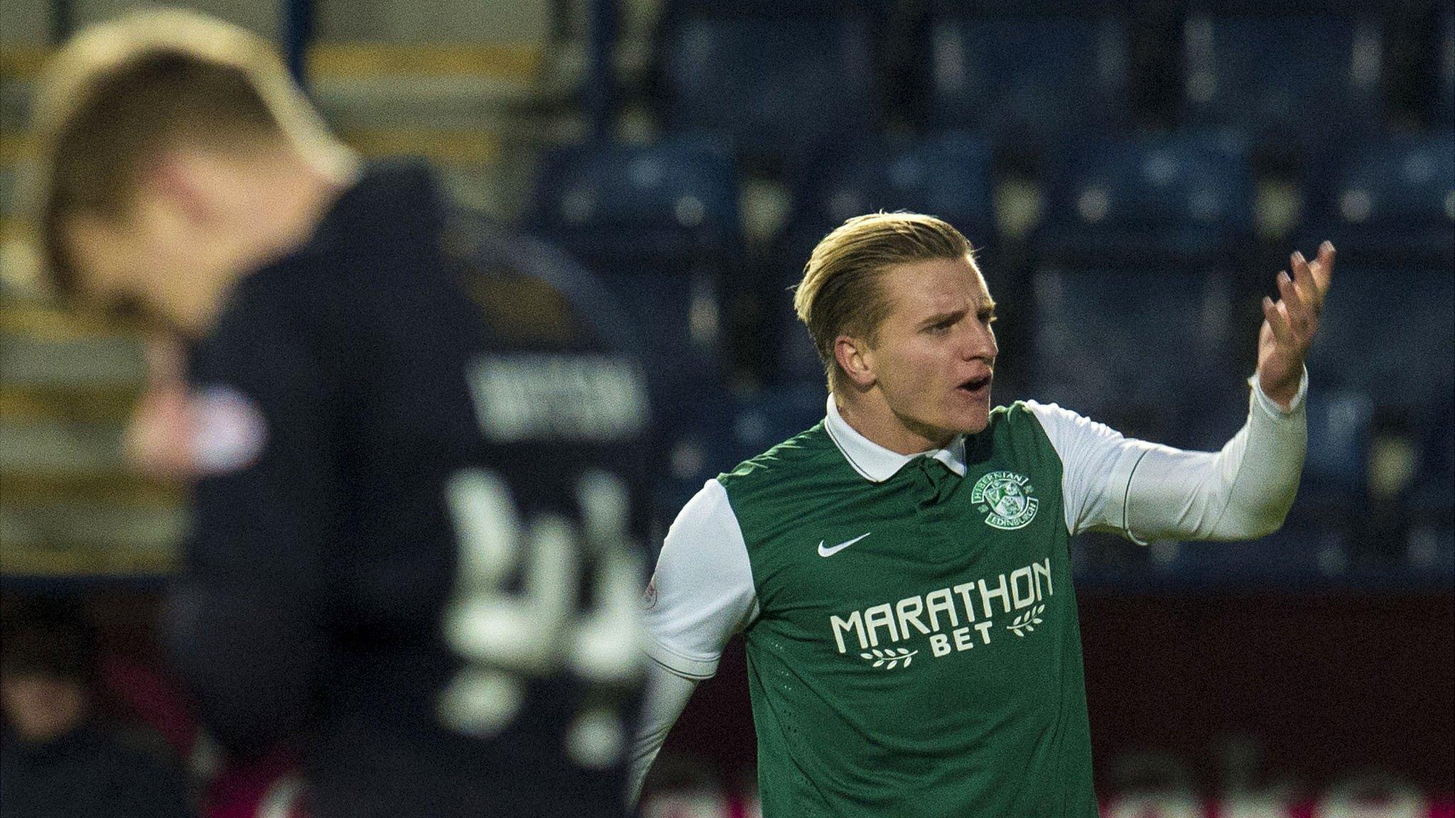 Jason Cummings celebrates after scoring for Hibernian against Falkirk