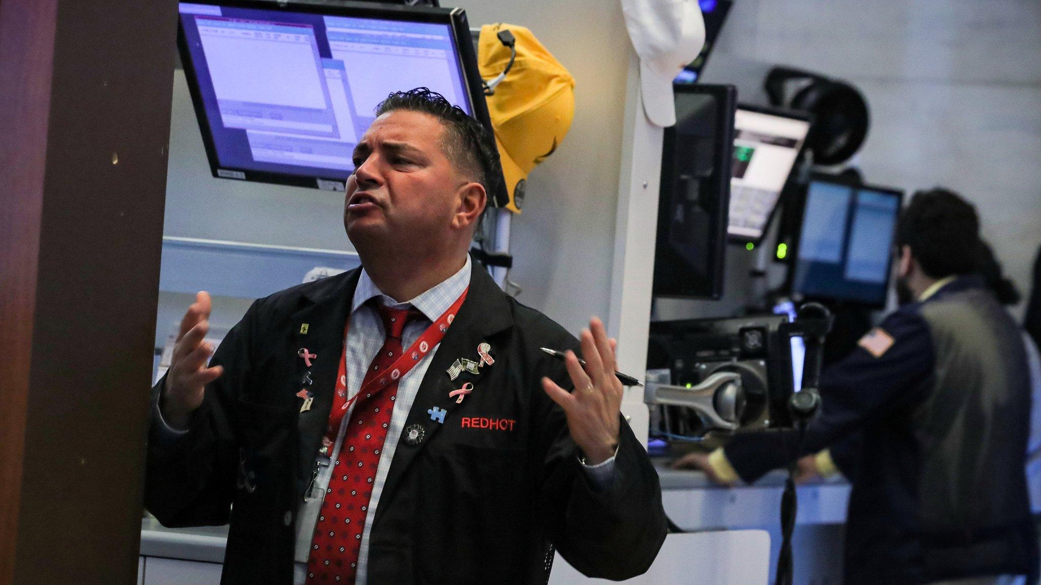 Traders work on the floor of the New York Stock Exchange (NYSE) in New York, U.S.,