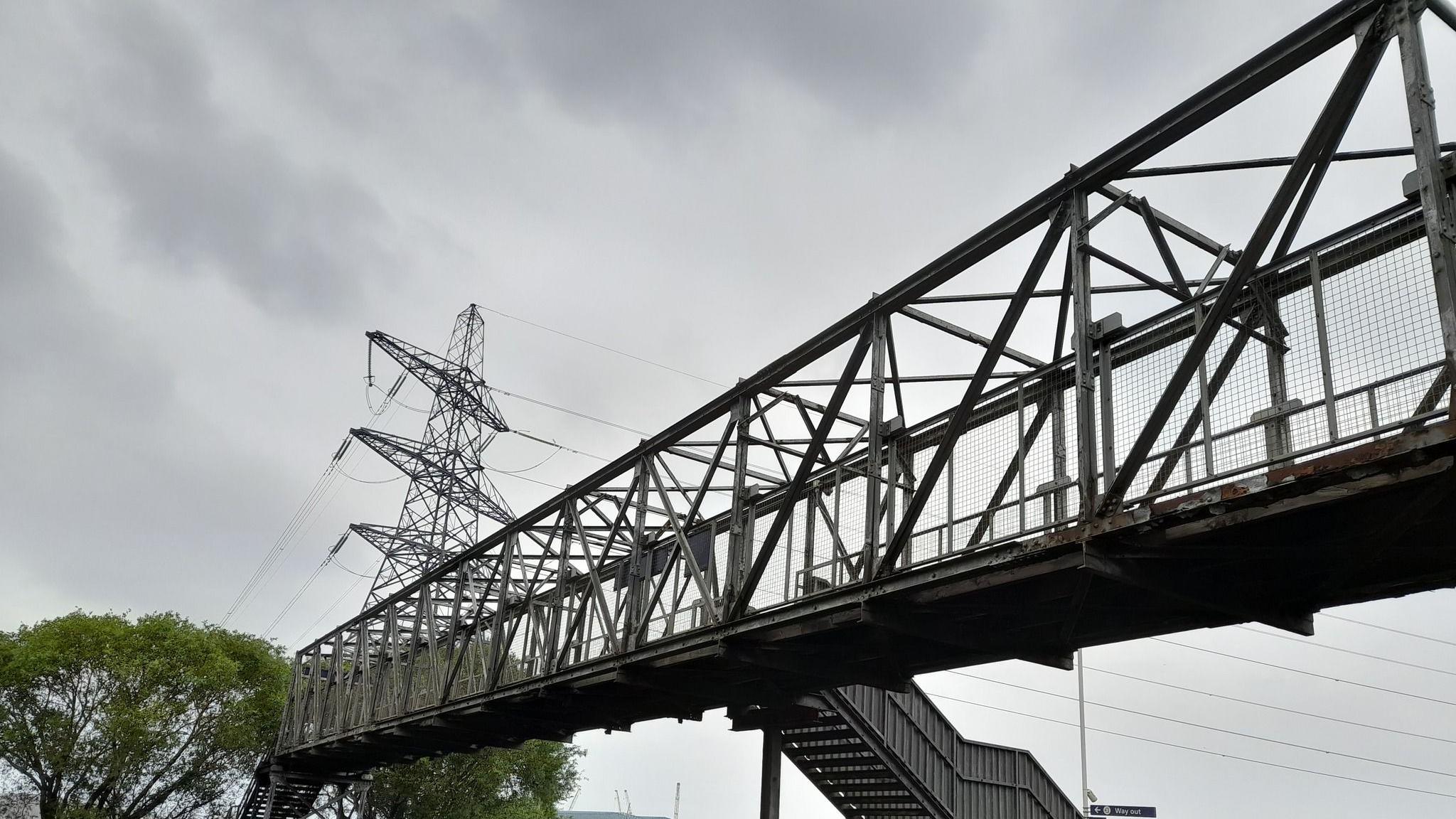 South Bank railway station. It is a grey metal structure with a parapet.