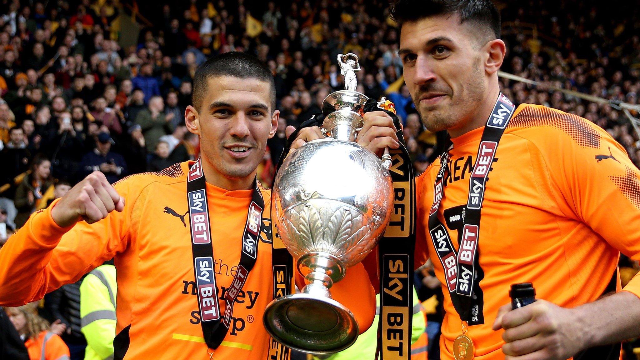 Wolves' Conor Coady and Danny Batth with the Championship trophy