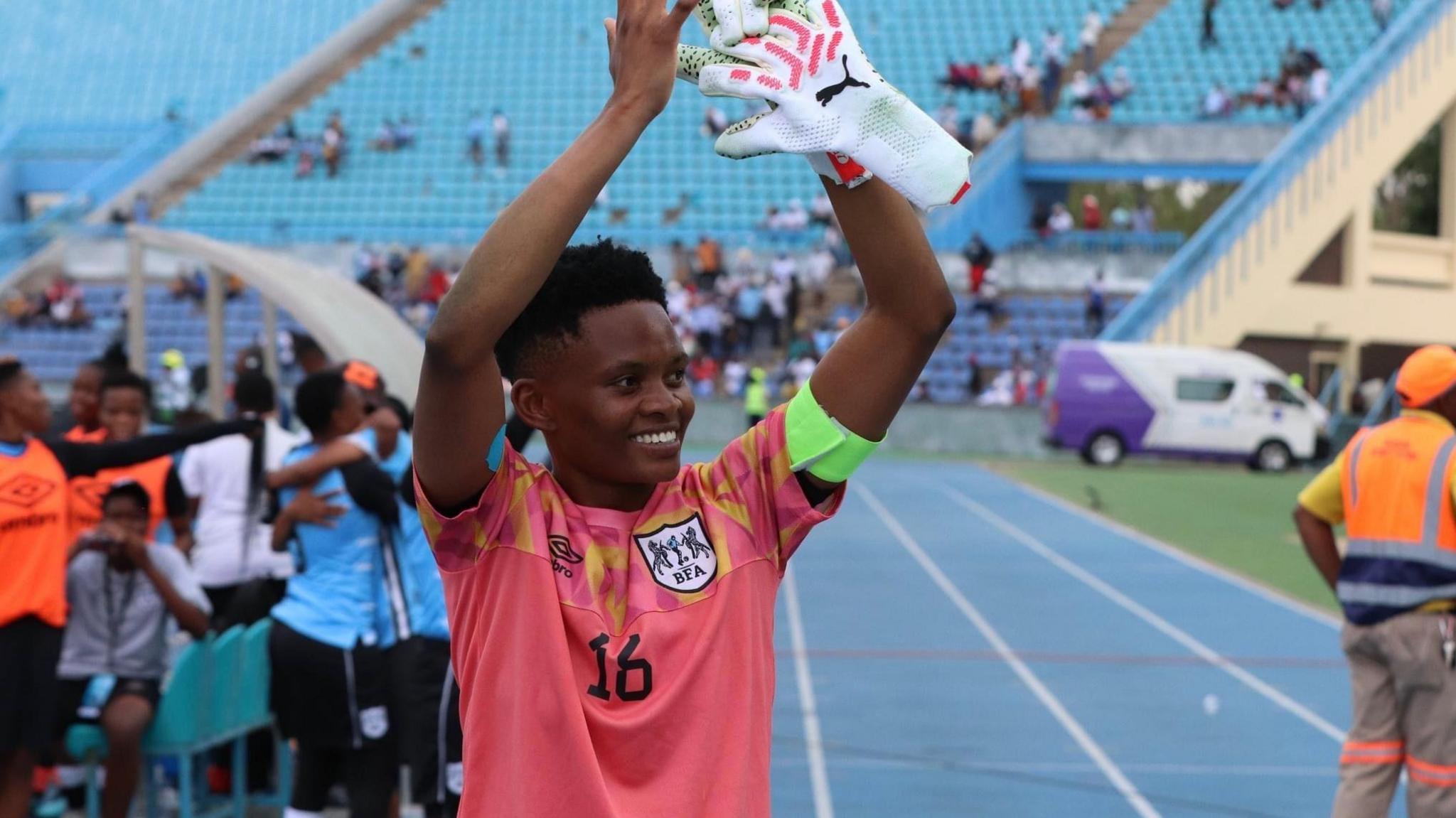 Botswana goalkeeper Sedilame Bosija puts her arms above her head as she applauds following a football match