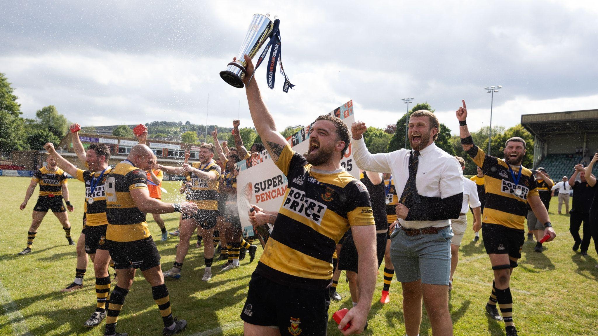 Newport players celebrate with the Super Rygbi Cymru trophy in 2025