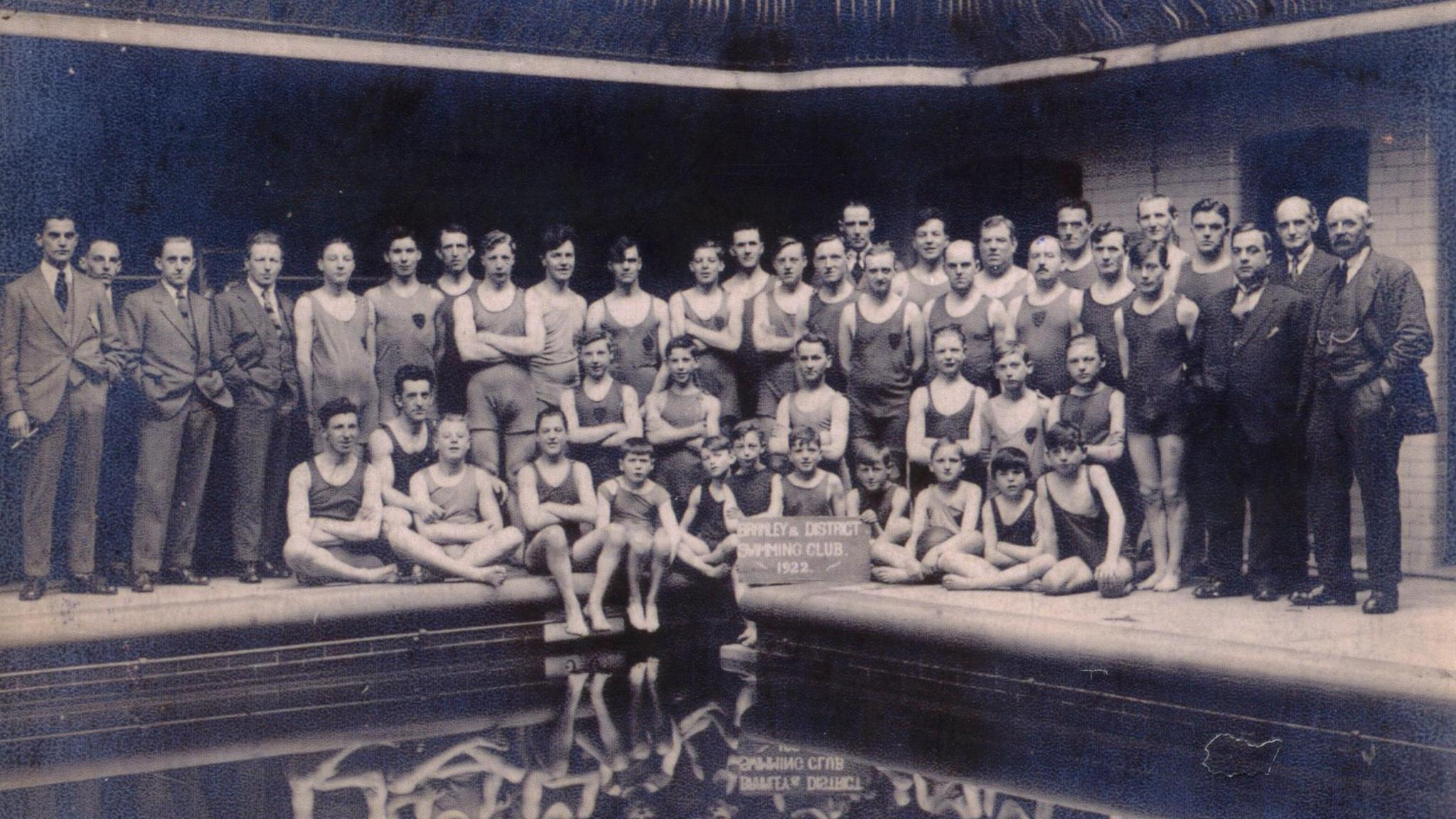 A historic black and white image of swimmers