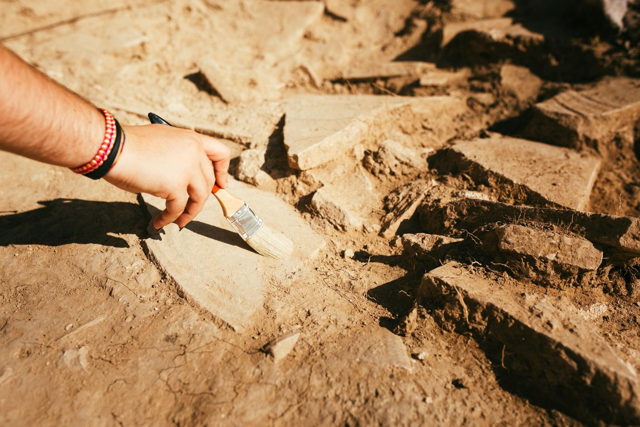 Archaeologist working on buried findings 