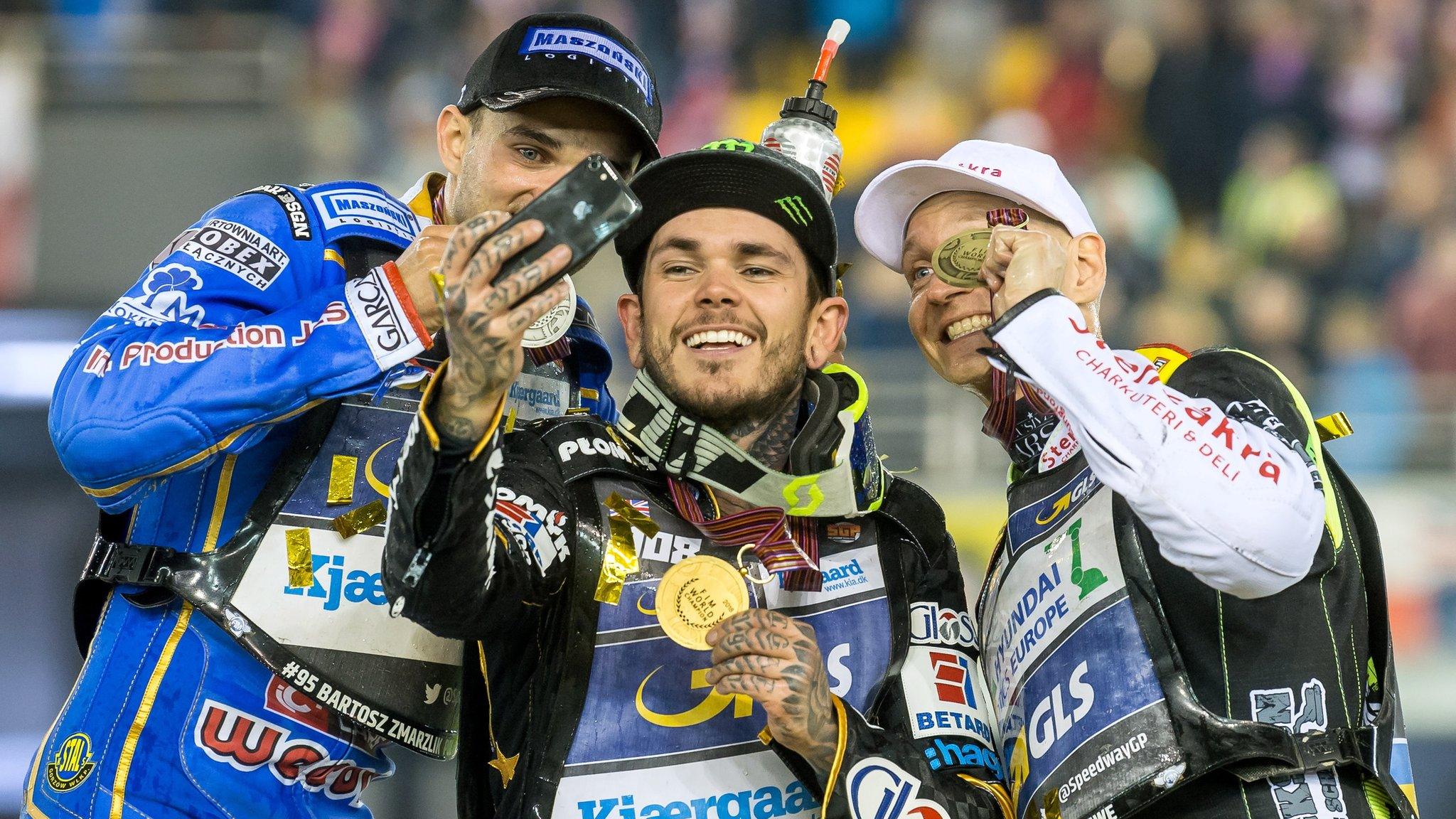 Torun, Poland, October 6: Britain's Tai Woffinden, centre, takes selfies with Poland's Bartosz Zmarzlik (L) and Sweden's Fredrik Lindgren after winning his third speedway world title to become the most decorated British rider of all time. His previous world titles came in 2013 and 2015. (Photo by Tytus Zmijewski/EPA)