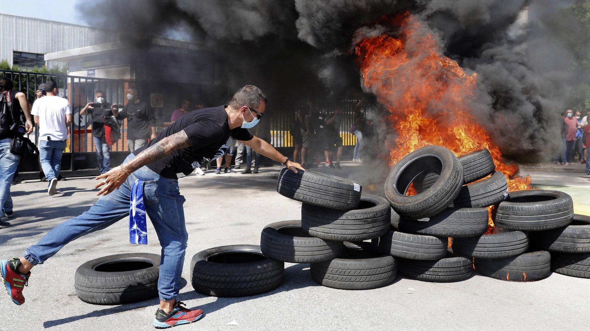 Protestors burned tyres in front of Nissan's plant in Barcelona which is being closed down