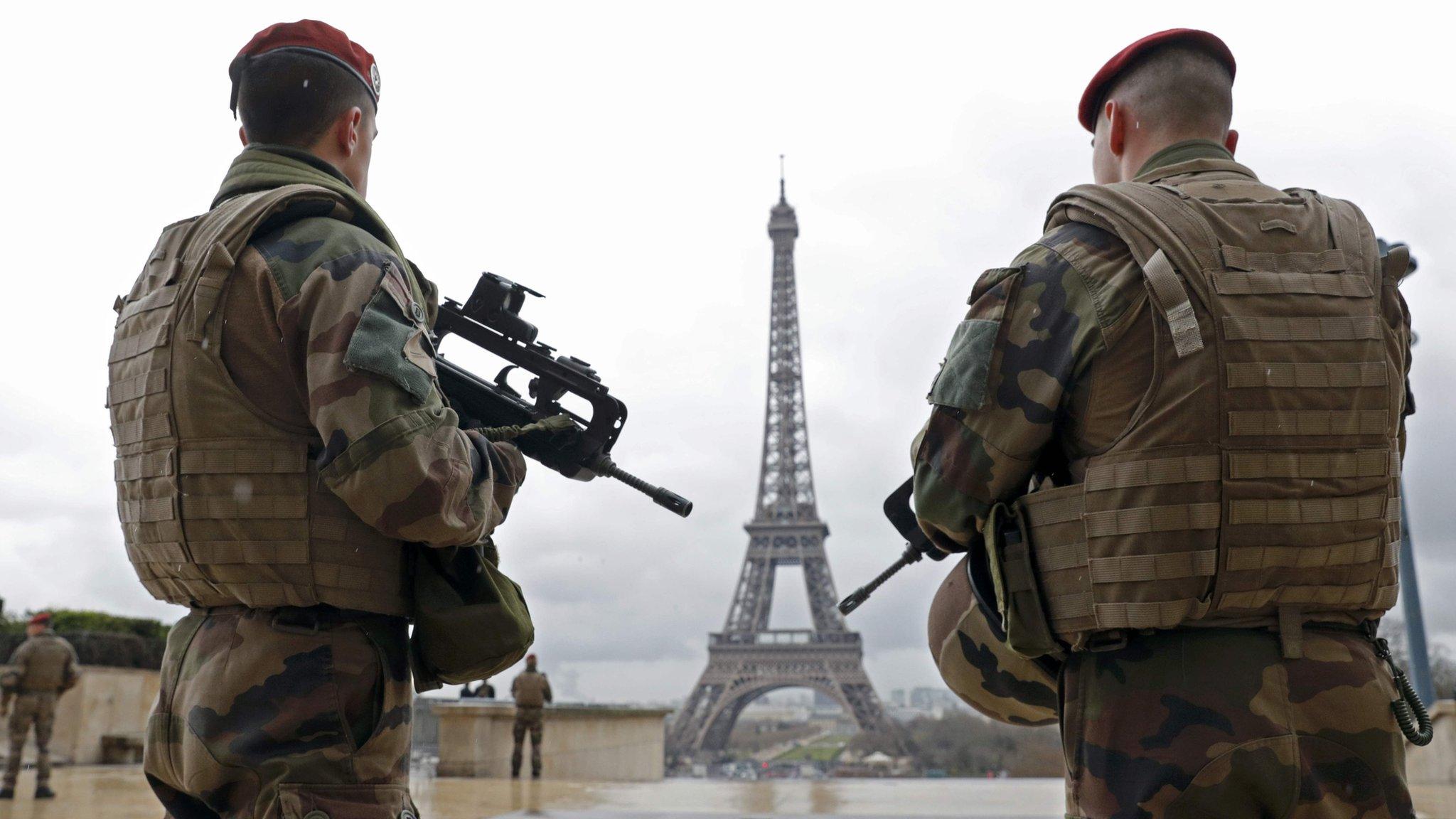 French army paratroopers patrol near the Eiffel Tower in Paris, in this picture taken on 30 March 2016.