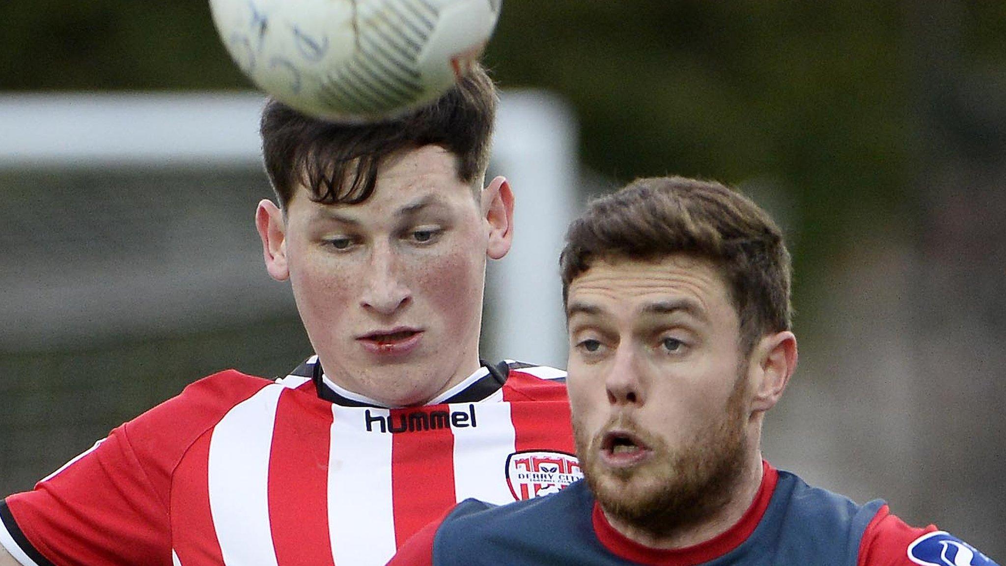 Derry's Conor McDermott battles with Sligo's John Russell