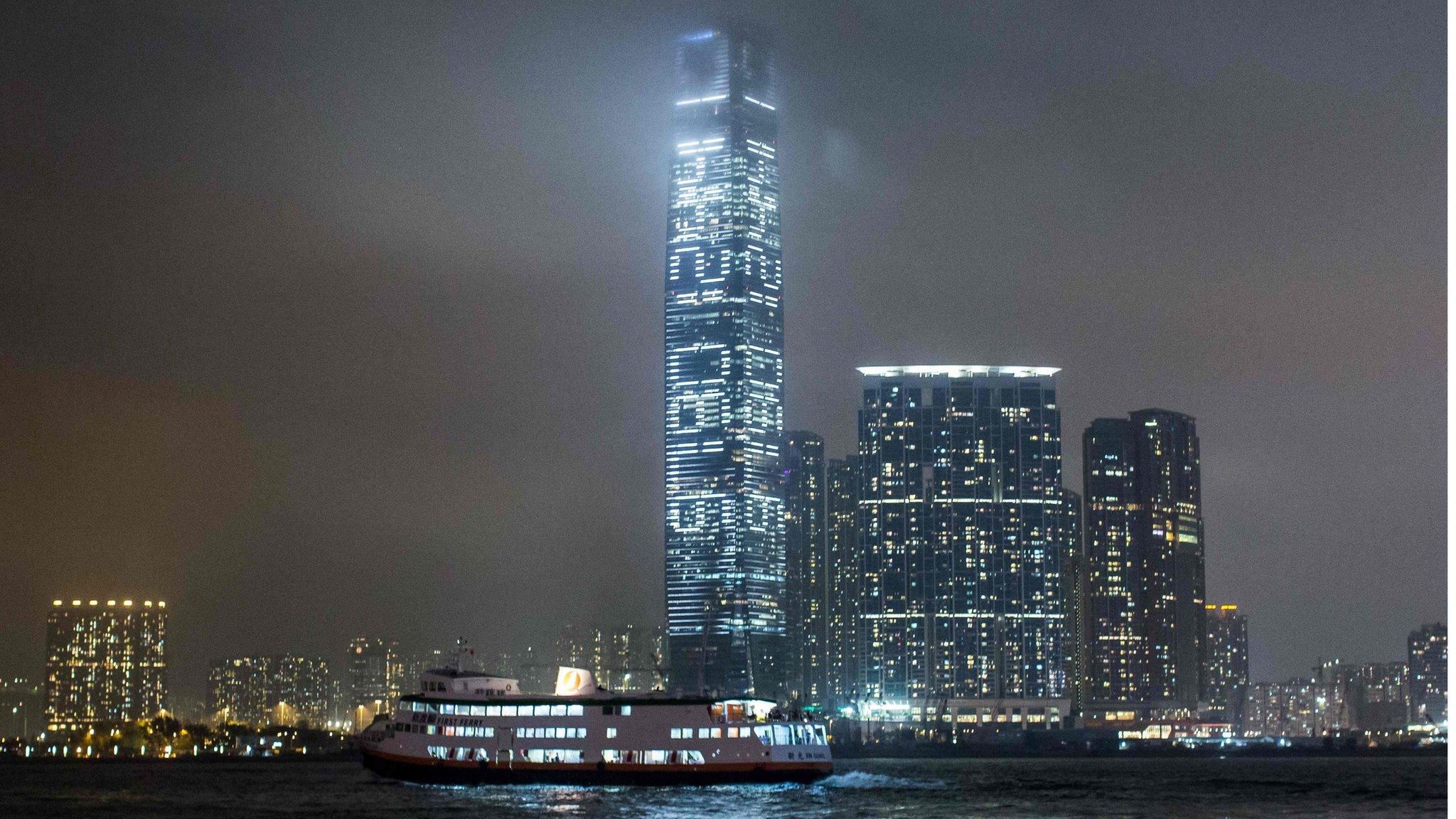 The ICC building, illuminated at night with the numbers of the artwork