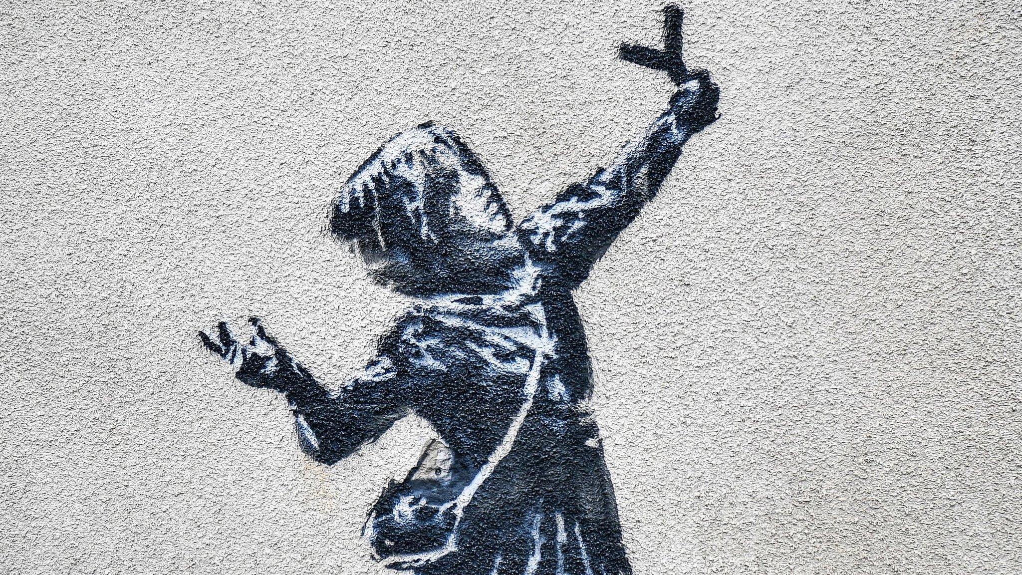 Banksy's girl with a slingshot