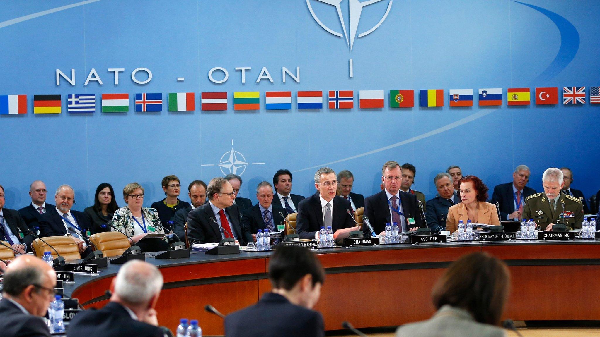 NATO Secretary General Jens Stoltenberg (C) addresses a NATO defence ministers meeting at the alliance's headquarters in Brussels on 10 February 2016