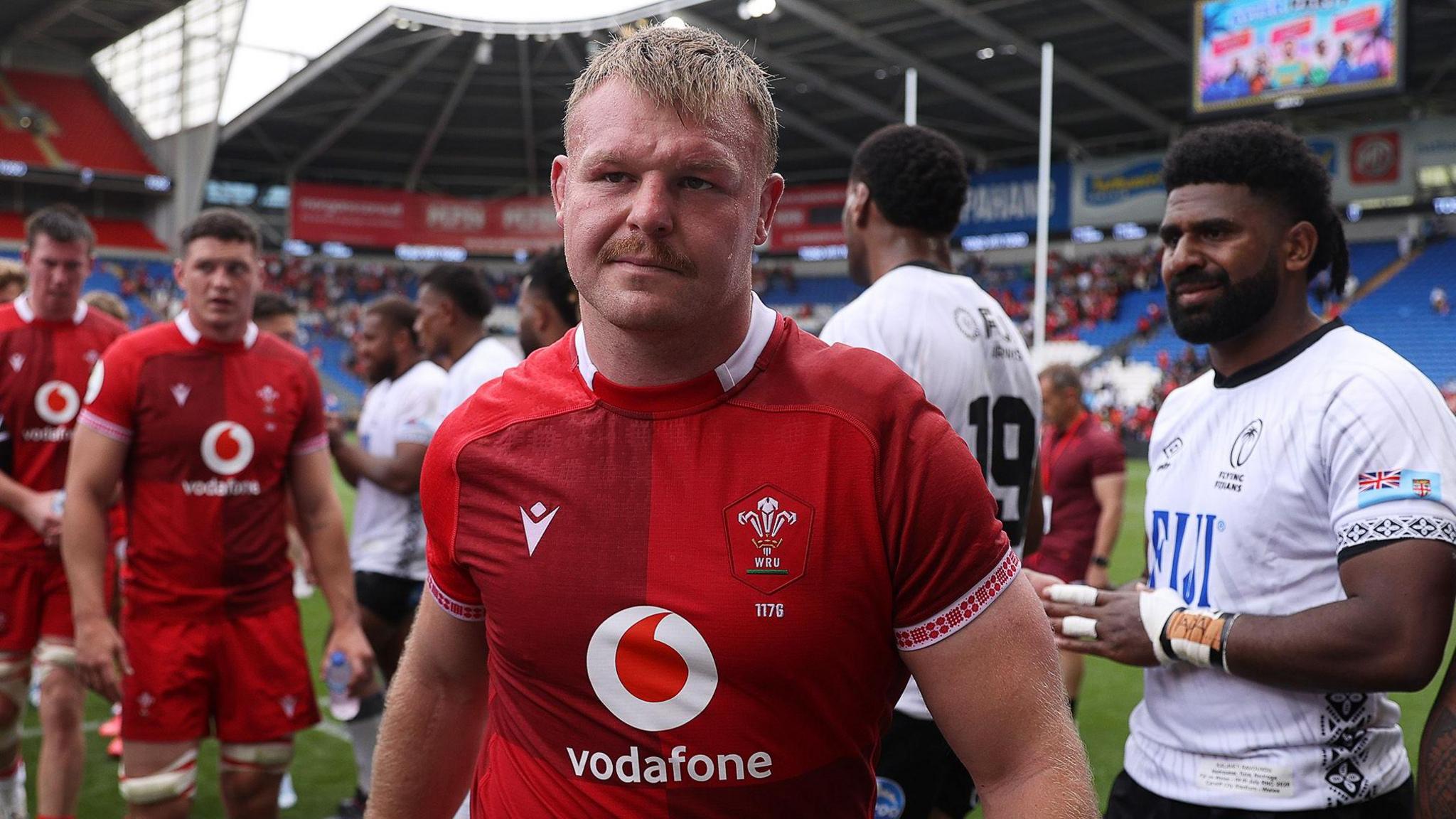Wales hooker Dewi Lake in the foreground as Fiji players applaud off the Wales team at Cardiff City Stadium