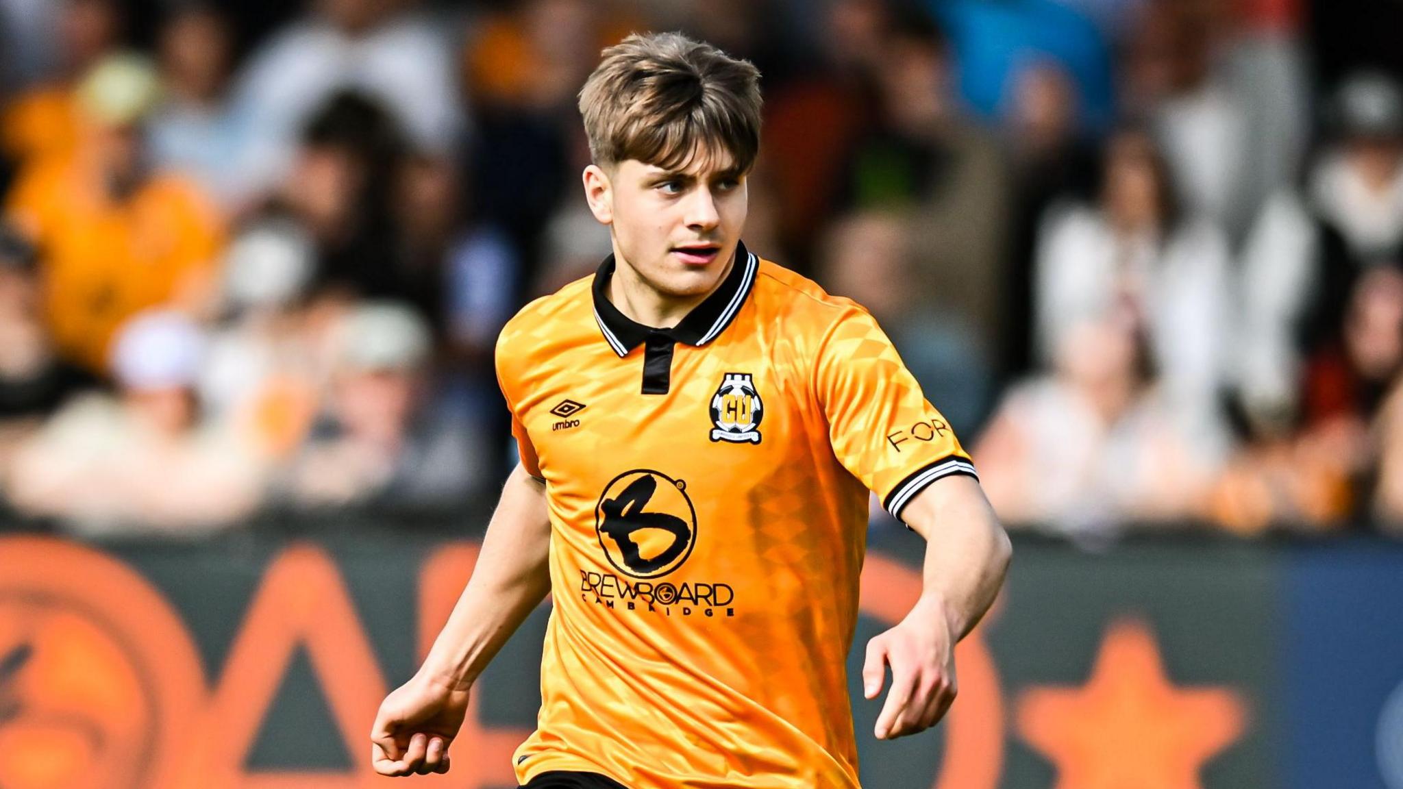 Josh Stokes on the pitch during a Cambridge United match