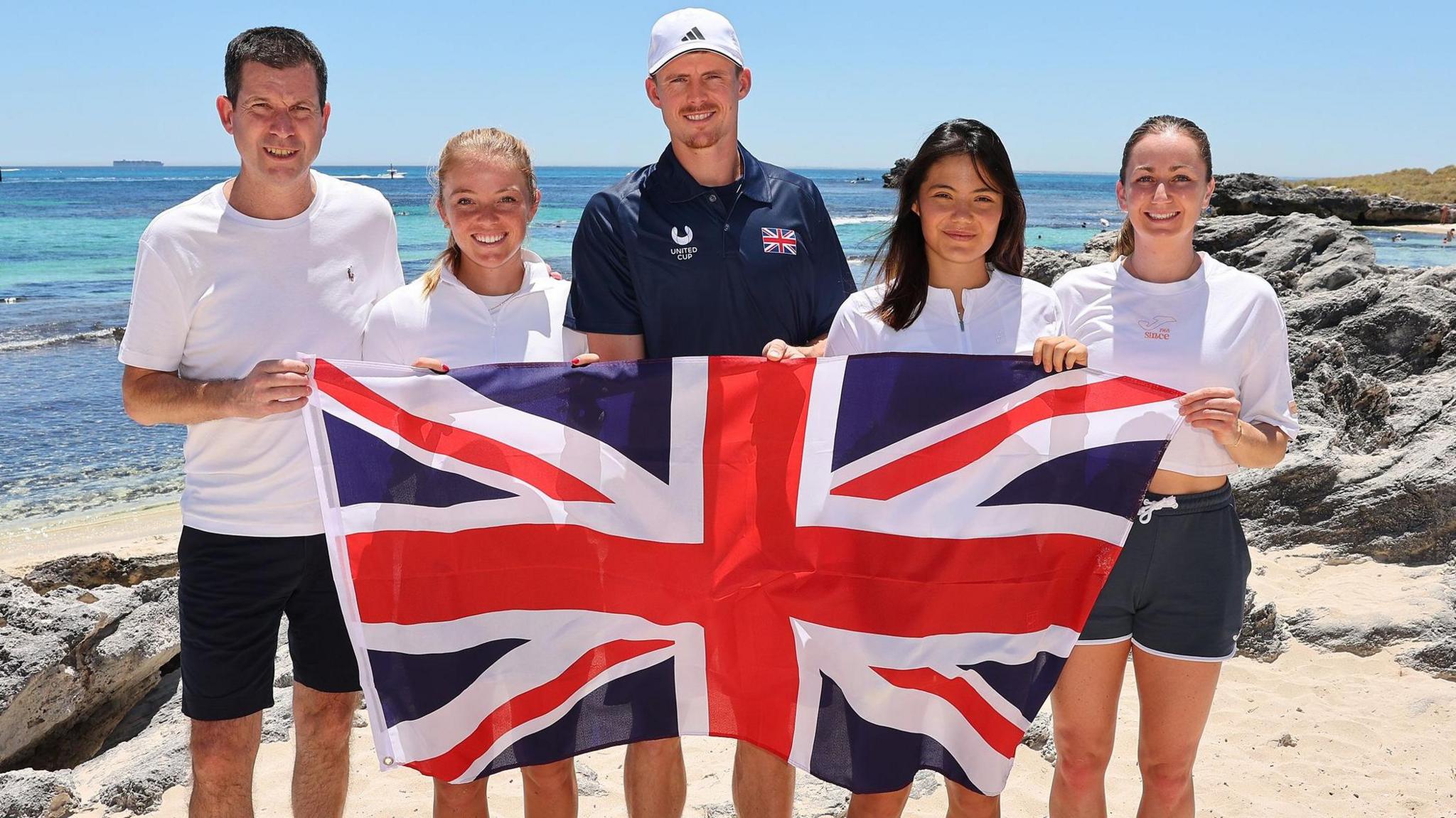Tim Henman, Katie Swan, Billy Harris, Emma Raducanu and Olivia Nicholls holding a Union Jack